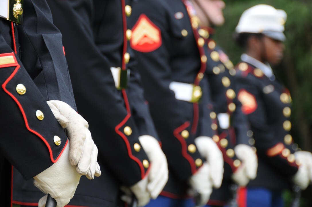 Rifle bearers from the Marine Corps Base Quantico Ceremonial Platoon stand at ceremonial at ease during the Potomac Region Veterans Council Memorial Day Ceremony held at Quantico National Cemetery on May 27, 2013. The event has been held for 30 years, paying homage fallen service members.