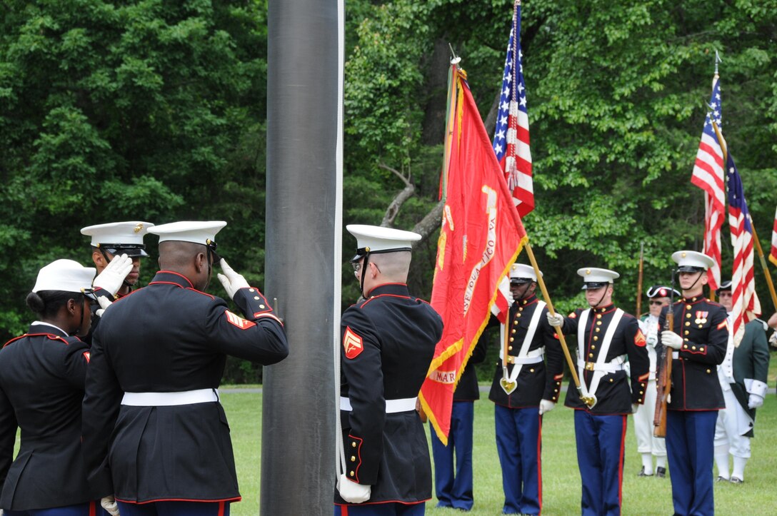 Marine Corps Base Quantico ceremonial platoon Marines salute during the national anthem at the start of the Potomac Region Veterans Council Memorial Day Ceremony was held at Quantico National Cemetery on May 27, 2013. The event has been held for 30 years, paying homage fallen service members.