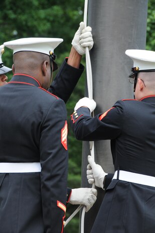 Marine Corps Base Quantico ceremonial platoon Marines stand ready to hoist the national ensign during the Potomac Region Veterans Council Memorial Day Ceremony was held at Quantico National Cemetery on May 27, 2013.  The day, originally called Decoration Day, is a day of remembrance for those who have died in service to our nation.