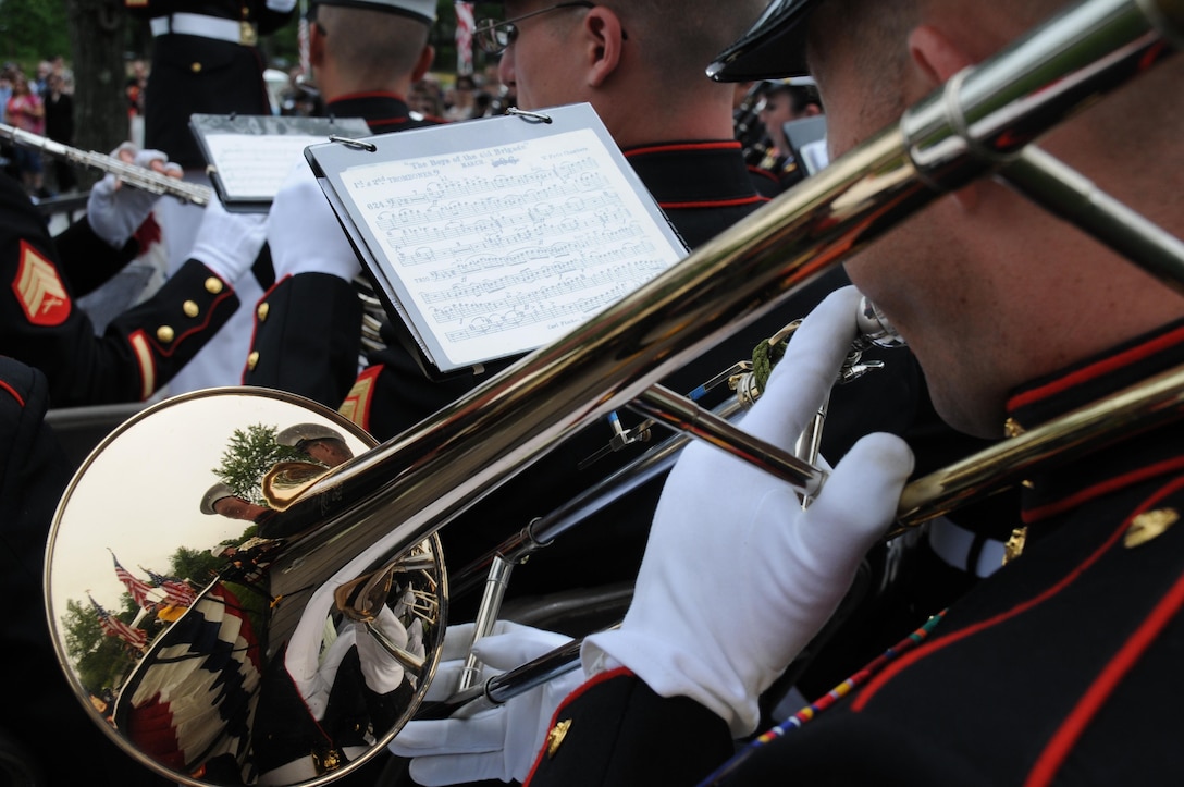 A trombonist with the Quantico Marine Band plays “God Bless America” during the Potomac Region Veterans Council Memorial Day Ceremony held at Quantico National Cemetery on May 27, 2013. The day, originally called Decoration Day, is a day of remembrance for those who have died in service to our nation.