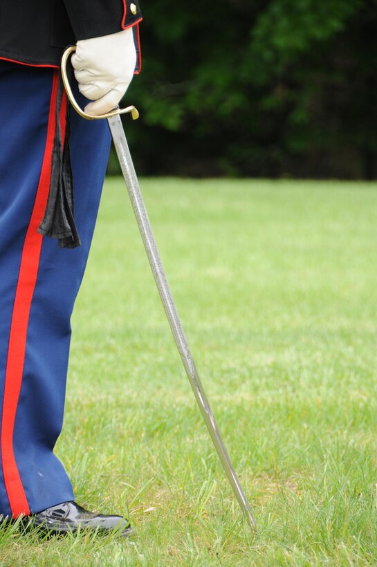 Corporal Steven McElfresh, rifle line noncommissioned officer, executes order sword during the Potomac Region Veterans Council Memorial Day Ceremony held at Quantico National Cemetery on May 27, 2013. The day, originally called Decoration Day, is a day of remembrance for those who have died in service to our nation.