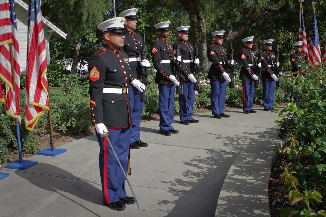 Sergeant Casimiro Zarate, a Bunkerville, Nev., native serving with 1st Reconnaissance Battalion, leads a seven-man rifle detail in a salute during the playing of "Taps" at the Richard Nixon Presidential Library and Museum for the Vietnam Prisoner of War 40th Annual Homecoming Reunion here, May 23, 2013. Nearly 200 former Vietnam POWs and their families gathered at the Nixon Presidential Library on the 40th anniversary of when President Nixon hosted the service members for the largest dinner ever held at the White House, May 24, 1973, on the South Lawn.