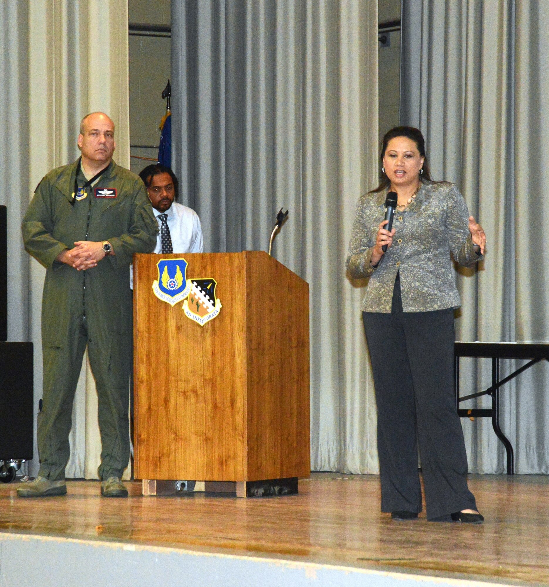 Brig. Gen. Michael T. Brewer, 412th Test Wing commander, and Michelle Lovato, Edwards AFB Civilian Personnel officer, answer questions from supervisors during the last of three meetings announcing the furlough notices to be handed out beginning May 28. (U.S. Air Force photo by Kenji Thuloweit) 