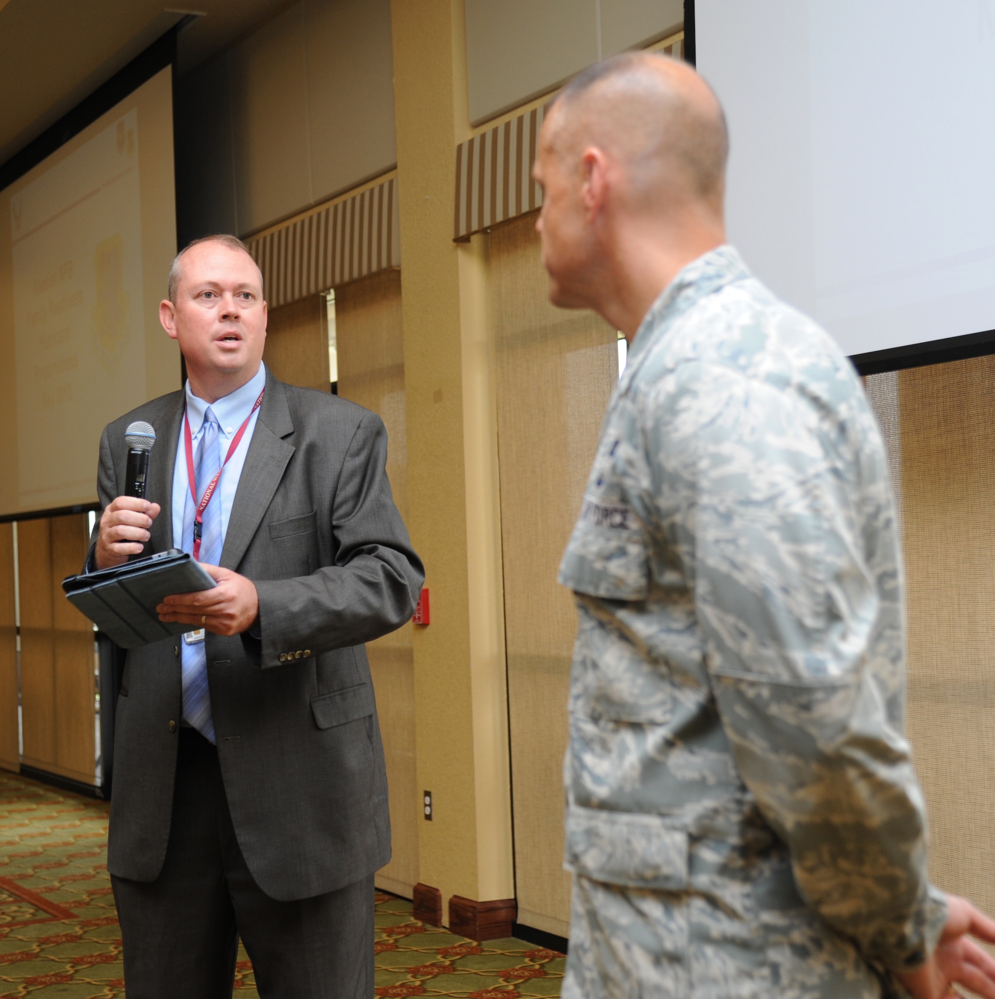 Ken Graham, New Orleans National Weather Service meteorologist in charge, presents the “Storm Ready Award” to Brig. Gen. Brad Spacy, 81st Training Wing commander, May 29, 2013, at the Bay Breeze Event Center, Keesler Air Force Base, Miss.  After 18 months of preparation, Keesler received the award, which was based on the base’s ability to handle severe storm conditions and took 18 months to qualify for.  (U.S. Air Force photo by Kemberly Groue)