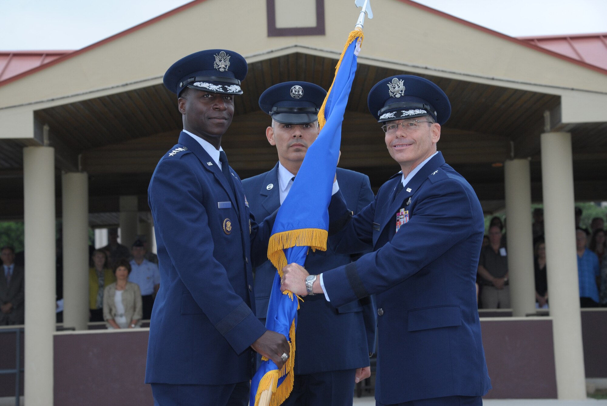 U.S. Air Force Gen. Edward A. Rice Jr., Air Education and Training Command commander, passes the guidon to Brig. Gen. Robert D. LaBrutta during the 502nd Air Base Wing and Joint Base San Antonio change of command ceremony May 29, 2013, at 9 a.m. at JBSA-Fort Sam Houston's MacArthur Parade Field. LaBrutta is the third commander of the 502nd ABW and JBSA, which provides installation support for JBSA-Fort Sam Houston, Lackland, Randolph and Camp Bullis.  JBSA is the largest joint base in the Department of Defense. His previous assignment was at U.S. Central Command, MacDill Air Force Base, Fla., where he was the director of  manpower and personnel. (U.S. Air Force Photo by Joel Martinez/Released)