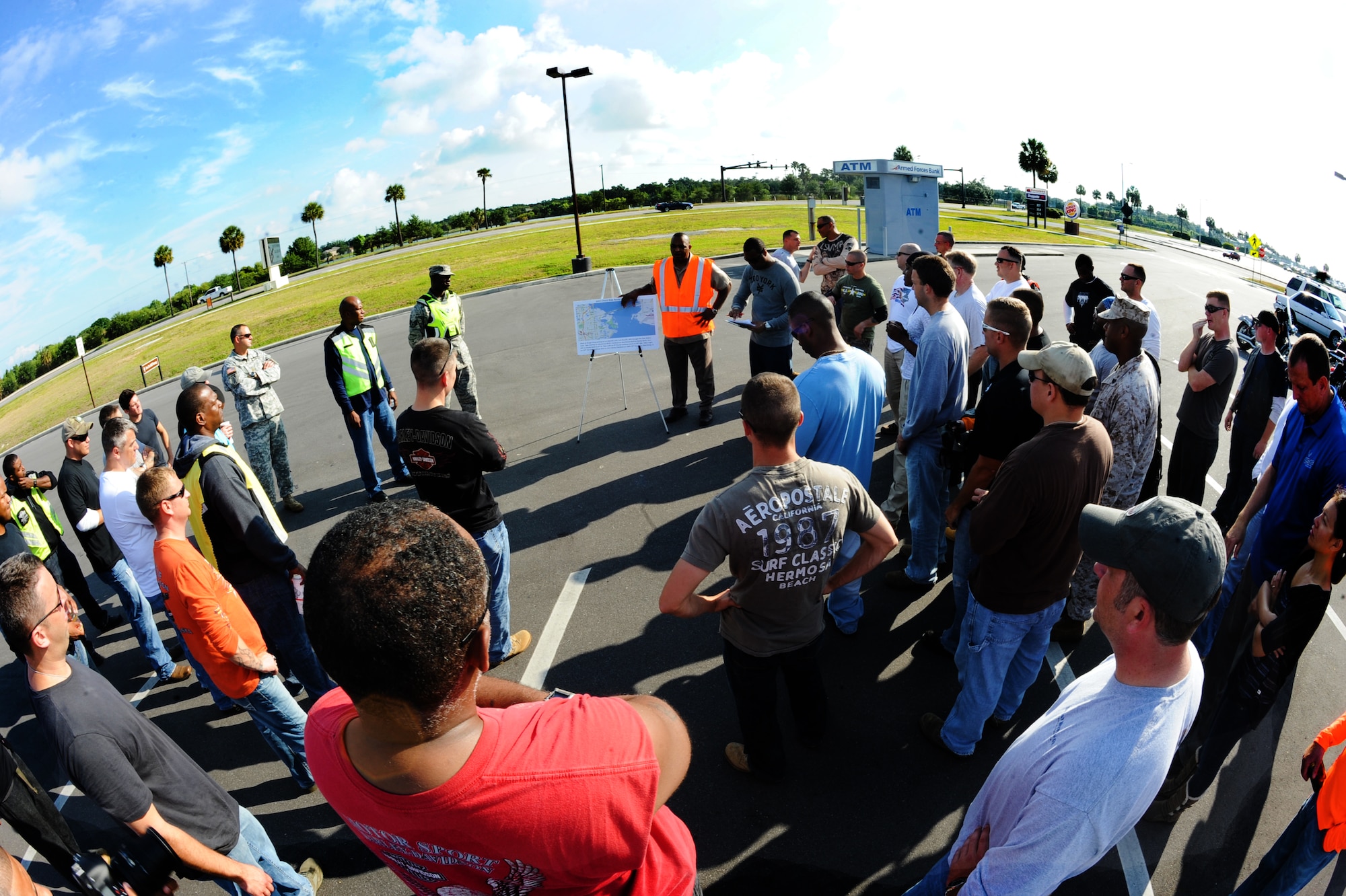Anthony Stennis, U.S. Central Command safety representative, briefs the group of riders on precautionary safety measures before the Joint Motorcycle Check Ride May 23, 2013, at MacDill Air Force Base, Fla. The JMCR's goal was to educate the novice and reinterate veteran riders on the motorcycle protocols of the road for military members. (U.S. Air Force photo by Senior Airman Michael Ellis/Released) 