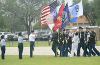 U.S. Army Col. Jim Chevallier, 502nd Air Base Wing vice commander and Joint Base San Antonio deputy commander, salutes a  joint honor guard as the present the colors during the 502nd Air Base Wing and Joint Base San Antonio change of command ceremony May 29, 2013, at 9 a.m. at JBSA-Fort Sam Houston's MacArthur Parade Field. The incoming commander Brig. Gen. Robert D. LaBrutta is the third commander of the 502nd ABW and JBSA, which provides installation support for JBSA-Fort Sam Houston, Lackland, Randolph, and Camp Bullis. JBSA is the largest joint base in the Department of Defense.  (U.S. Air Force photo by Benjamin Faske) (released)