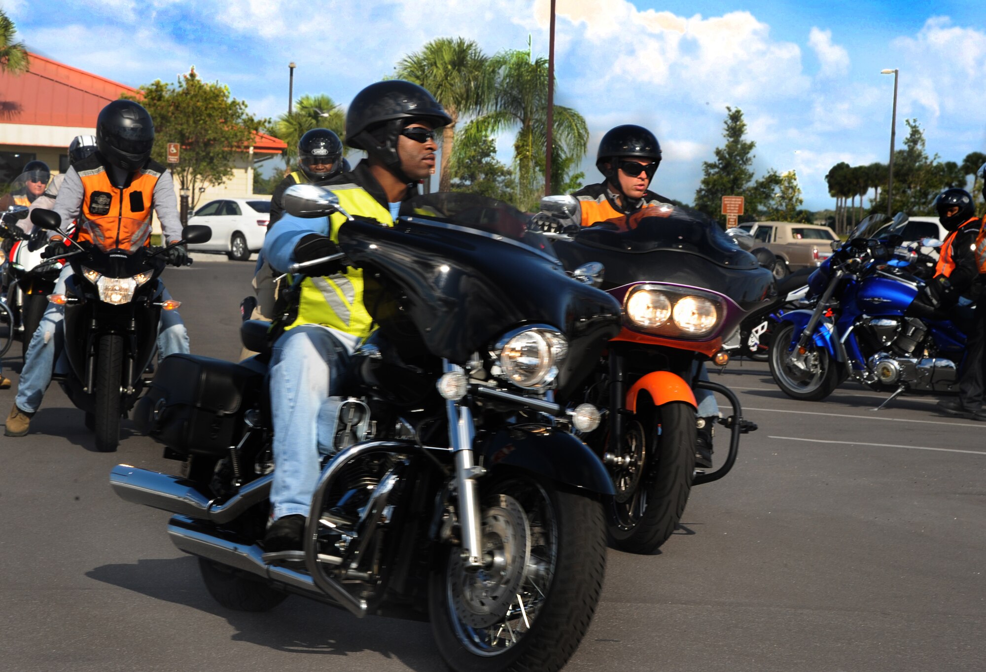 Master Sgt. Danell Hall, U.S. Special Operations Central Command intelligence superintendent, rides his cruiser during the Joint Motorcycle Check Ride May 23, 2013,  at MacDill Air Force Base, Fla. The JMCR's goal was to educate the novice and reinterate veteran riders on the motorcycle protocols of the road for military members. (U.S. Air Force photo by Senior Airman Michael Ellis/Released)
