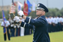 U.S. Air Force Capt. Michael Hoerber leads a ceremonial band with Army and Air Force members during the 502nd Air Base Wing and Joint Base San Antonio change of command ceremony May 29, 2013, at 9 a.m. at JBSA-Fort Sam Houston's MacArthur Parade Field. Brig. Gen. Robert D. LaBrutta is the third commander of the 502nd ABW and JBSA, which provides installation support for JBSA-Fort Sam Houston, Lackland, Randolph, and Camp Bullis. (U.S. Air Force photo by Benjamin Faske) (released)