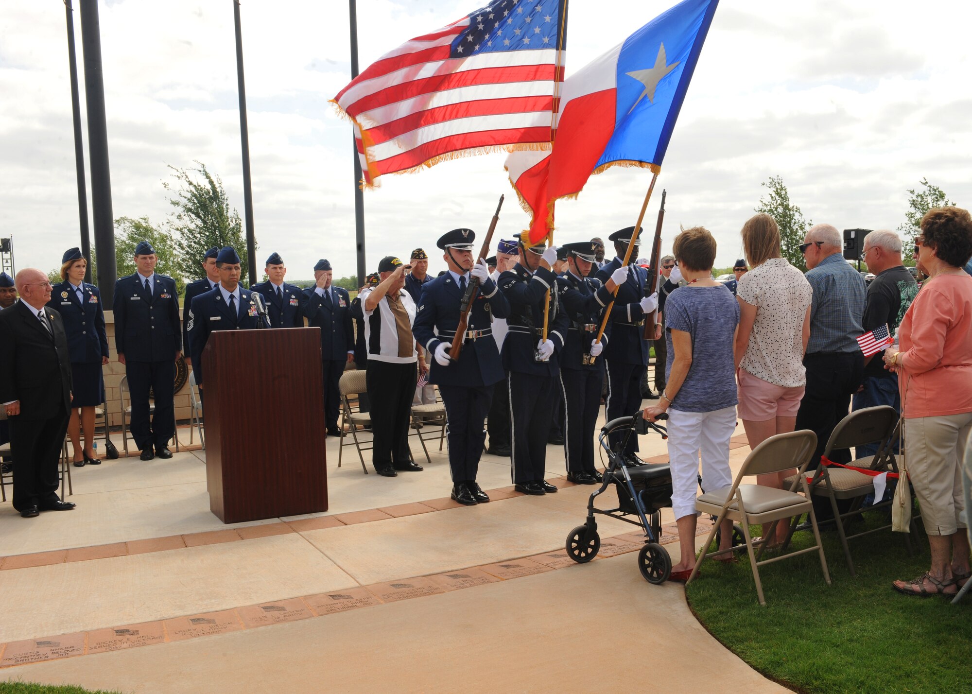 The Dyess Honor Guard presents the colors during a Memorial Day ceremony held at the Texas State Veterans Cemetery in Abilene, Texas, May 27, 2013. The ceremony featured guest speaker retired U.S. Army Brig. Gen. Robert J. Strader, a Korean War veteran. During his speech, Strader shared a few of his personal war stories with the audience. (U.S. Air Force photo by Senior Airmen Cierra Presentado/Released)