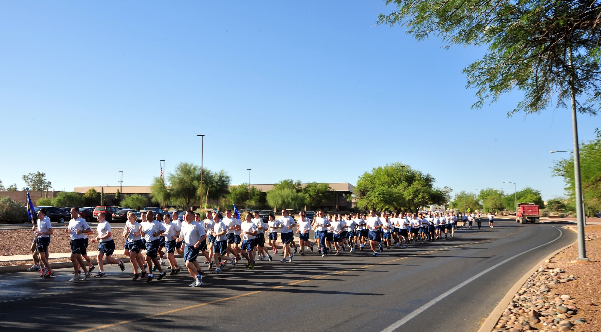 U.S. Air Force Airmen from the 355th Fighter Wing kicked off Comprehensive Airman Fitness Week with a mile-and-a-half run at Davis-Monthan Air Force Base, Ariz., May 20, 2013. The week's activities were focused on highlighting safety, resiliency and the social pillar of CAF and started with the wing run, followed by a wingman scavenger hunt where teams of four had to work together to find information and objects related to CAF's social pillar and resiliency. (U.S. Air Force photo by Airman 1st Class Josh Slavin/Released) 