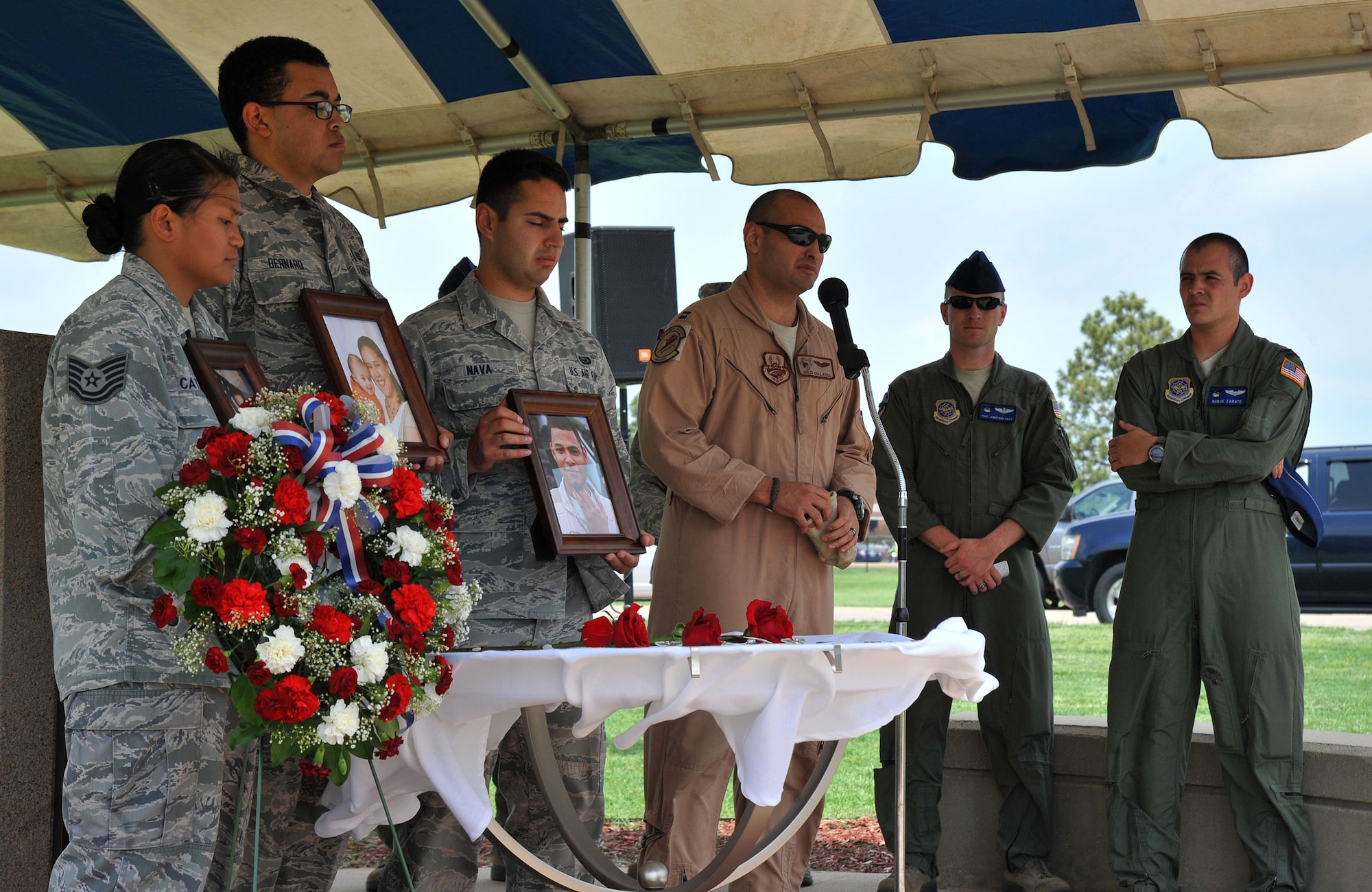 Capt. Julio Collazos, 349th Air Refueling Squadron, speaks about the character of fallen Shell 77 aircrew member, Capt. Mark Tyler Voss, during a memorial ceremony at McConnell Air Force Base, Kan., May 28, 2013. The service allowed people to pay their respects and remember Tech. Sgt. Herman “Tre” Mackey, III, Capt. Victoria A. Pinckery, and Captain Voss, who were assigned to the 93rd Air Refueling Squadron, Fairchild AB, Wash., and died tragically May 3, when their KC-135 Stratotanker crashed in Kyrgyzstan in Support of Operation Enduring Freedom. (U.S. Air Force photo/ Staff Sgt. Jess Lockoski)