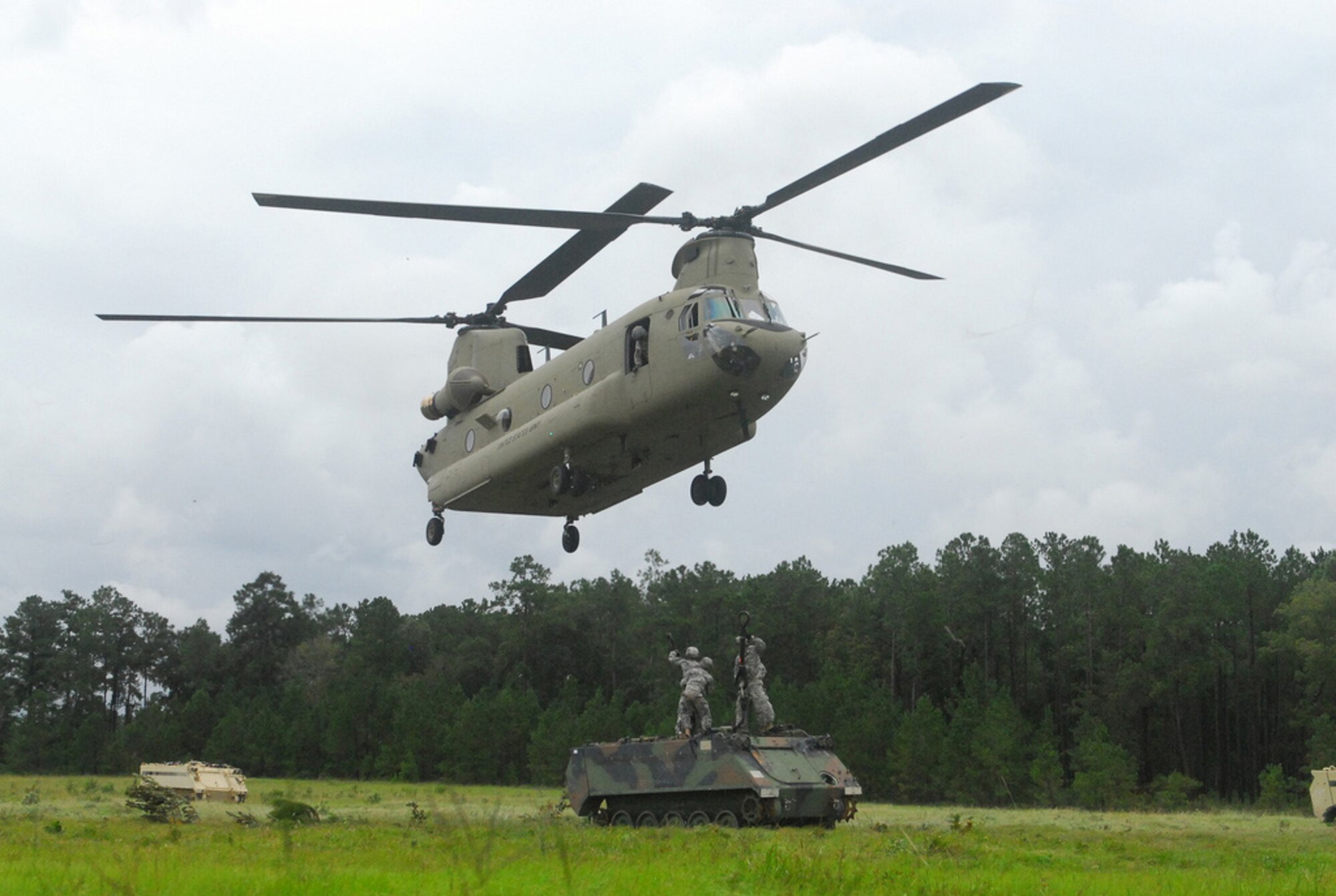 The CH-47 Chinook helicopter will be getting upgrades for its F and G models under the proposed fiscal year 2014 Army Equipment Modernization Plan and the Armored Multi-Purpose Vehicle is replacing the Vietnam-era M113 armored personnel carrier in phases. Shown here, Soldiers from the 8th Cavalry Regiment, 4th Infantry Brigade Combat Team, 3rd Infantry Division, slingload an M113 to a CH-47 helicopter recently at Fort Stewart, Ga. (Army file photo)