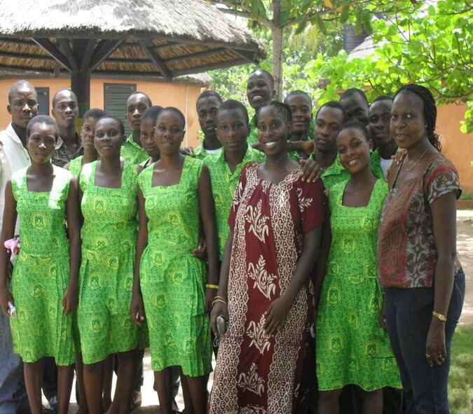 United States Air Force Capt. Derandoria Young (right of center),49th Medical Operations Squadron, poses with Ghana students and staff during her studies abroad in Ghana, Africa, in 2010. Sponsored by the University of Texas School of Social Work, the Maymester Abroad Course provided 61 students the opportunity to broaden their educational horizons. (photo courtesy of Capt. Derandoria Young/Released)