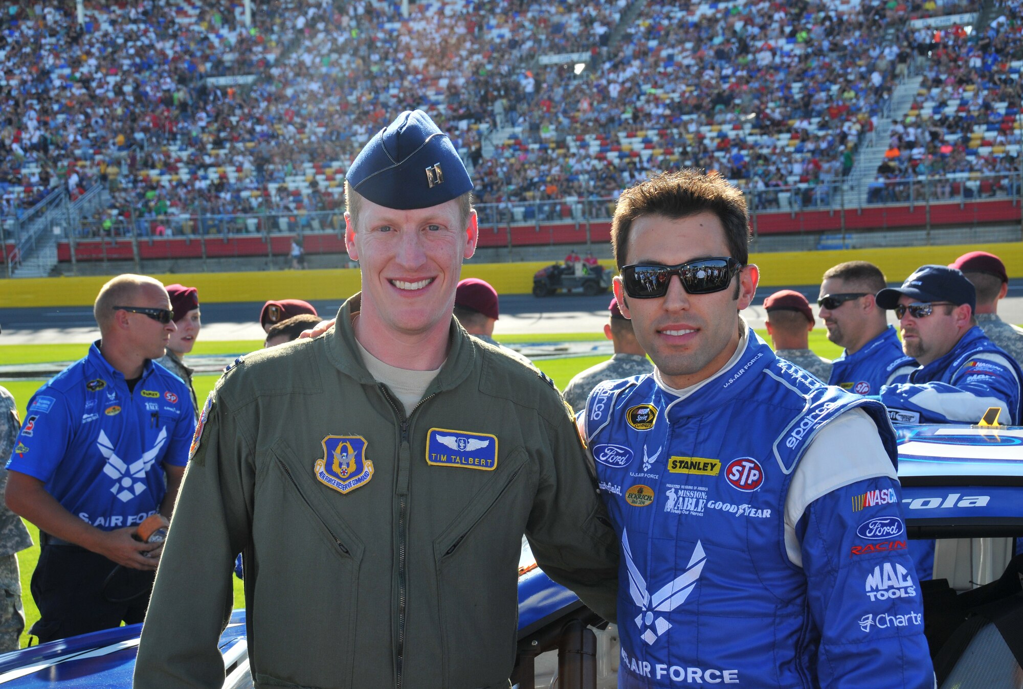 Capt. Timothy Talbert wishes driver Aric Almirola luck before the Coca Cola 600 at Charlotte Motor Speedway in Concord, N.C., May 26, 2013.  Almirola is the driver of the number 43 Air Force Ford Fusion.  Talbert was one of 43 service members from Fort Bragg and Pope Field, N.C. who were given VIP treatment at the Charlotte Motor Speedway race.  Talbert is a flight nurse with the 36th Aeromedical Evacuation Squadron at Pope Field.  (US Air Force photo by Adam Luther, 440 AW/PA)