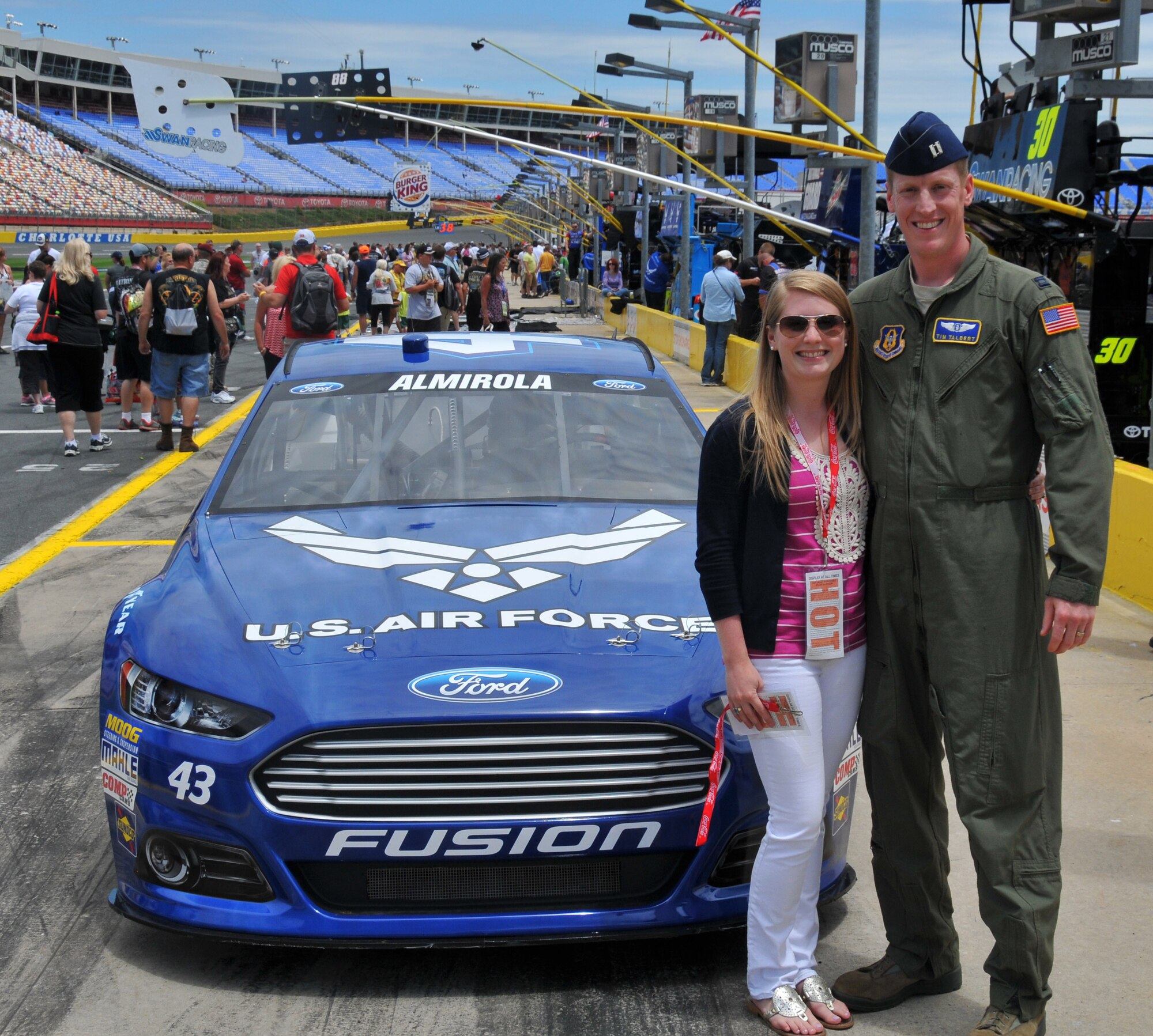 Capt. Timothy Talbert and his wife Erica stand with number 43 Air Force car driven by Aric Almirola at the Coca Cola 600 May 26, 2013.  Talbert was one of 43 service members from Fort Bragg and Pope Field, N.C. who were given VIP treatment at the Charlotte Motor Speedway race.  Talbert is a flight nurse with the 36th Aeromedical Evacuation Squadron at Pope Field.  (US Air Force photo by Adam Luther, 440 AW/PA)