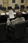 An air reserve technician assigned to the 512th Airlift Wing reviews the notice of proposed furlough he received May 29, 2013, on Dover Air Force Base, Del. The chief master sergeant is one of 250 512th Airlift Wing federal employees who received the memorandum, which outlined furlough plans from July 8 to September 21, 2013.  (U.S. Air Force photo/Master Sgt. Veronica Aceveda)