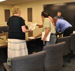 The chief of an office in the Air Force Reserve’s 512th Airlift Wing disseminates notices of proposed furlough to her staff May 29, 2013, on Dover Air Force Base, Del. About 250 civilian employees received the memorandum, which outlined a planned furlough not to exceed 11 workdays, beginning July 8, 2013. (U.S. Air Force photo/Master Sgt. Veronica Aceveda)   