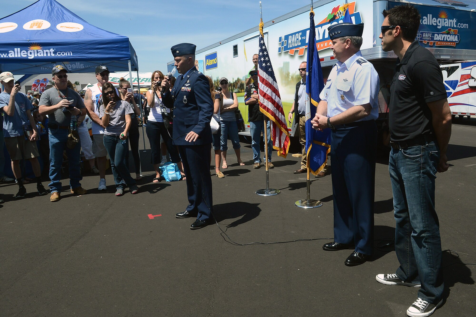 A crowd gathers to watch Air Force Chief of Staff Gen. Mark A. Welsh III give the oath of enlistment to recruits in the Delayed Entry Program at a NASCAR race, Charlotte, N.C., May 26, 2013. (U.S. Air Force photo/Airman 1st Class Nicole Sikorski)