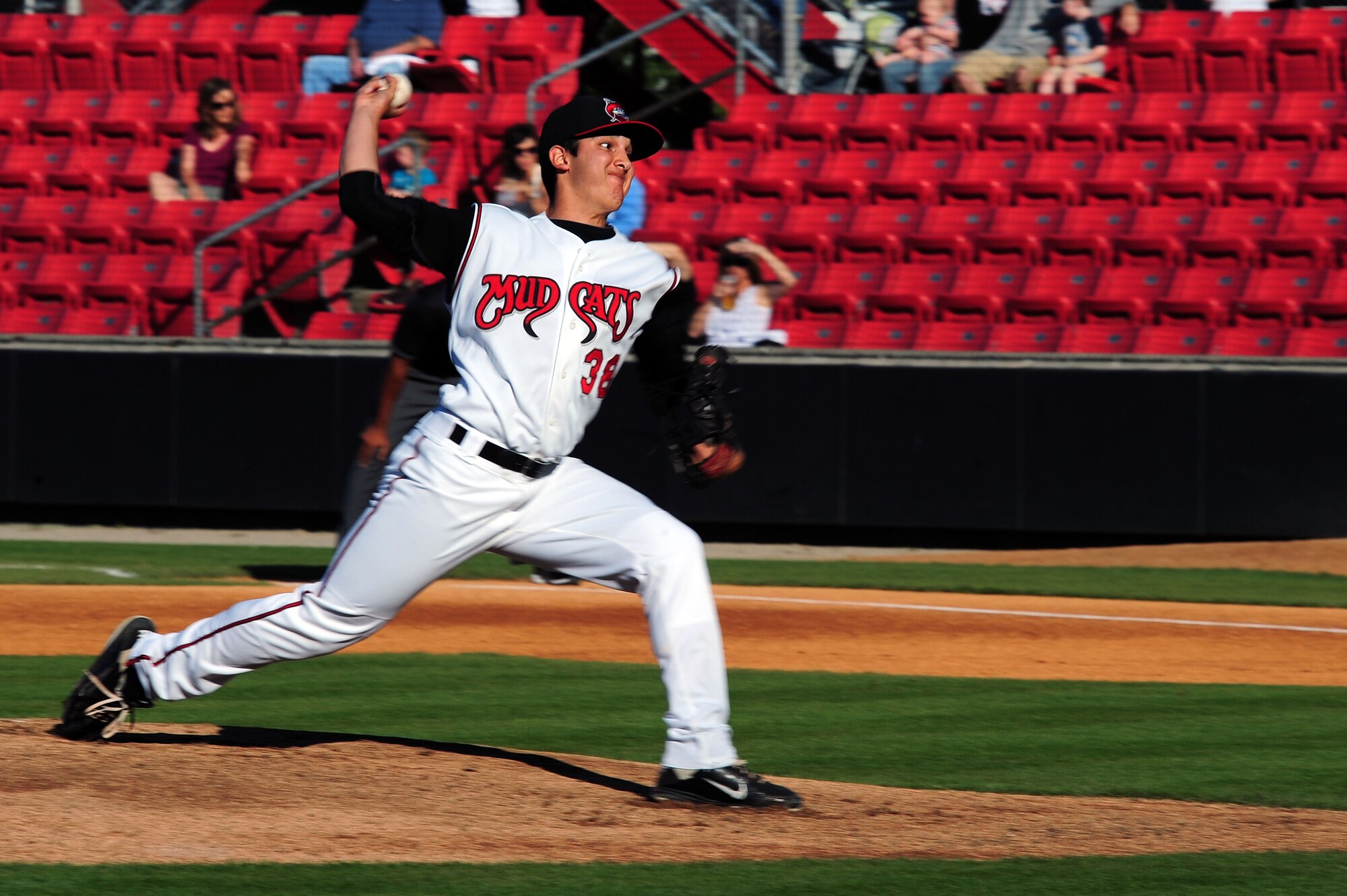 Nick Pasquale, Carolina Mudcats pitcher, delivers a pitch during the first inning at the Carolina Mudcats stadium in Zebulon, N.C., May 25, 2013. Service members were invited to come out and enjoy a game at no cost for the Memorial Day holiday. (U.S. Air Force photo by Airman 1st Class John Nieves Camacho/Released)