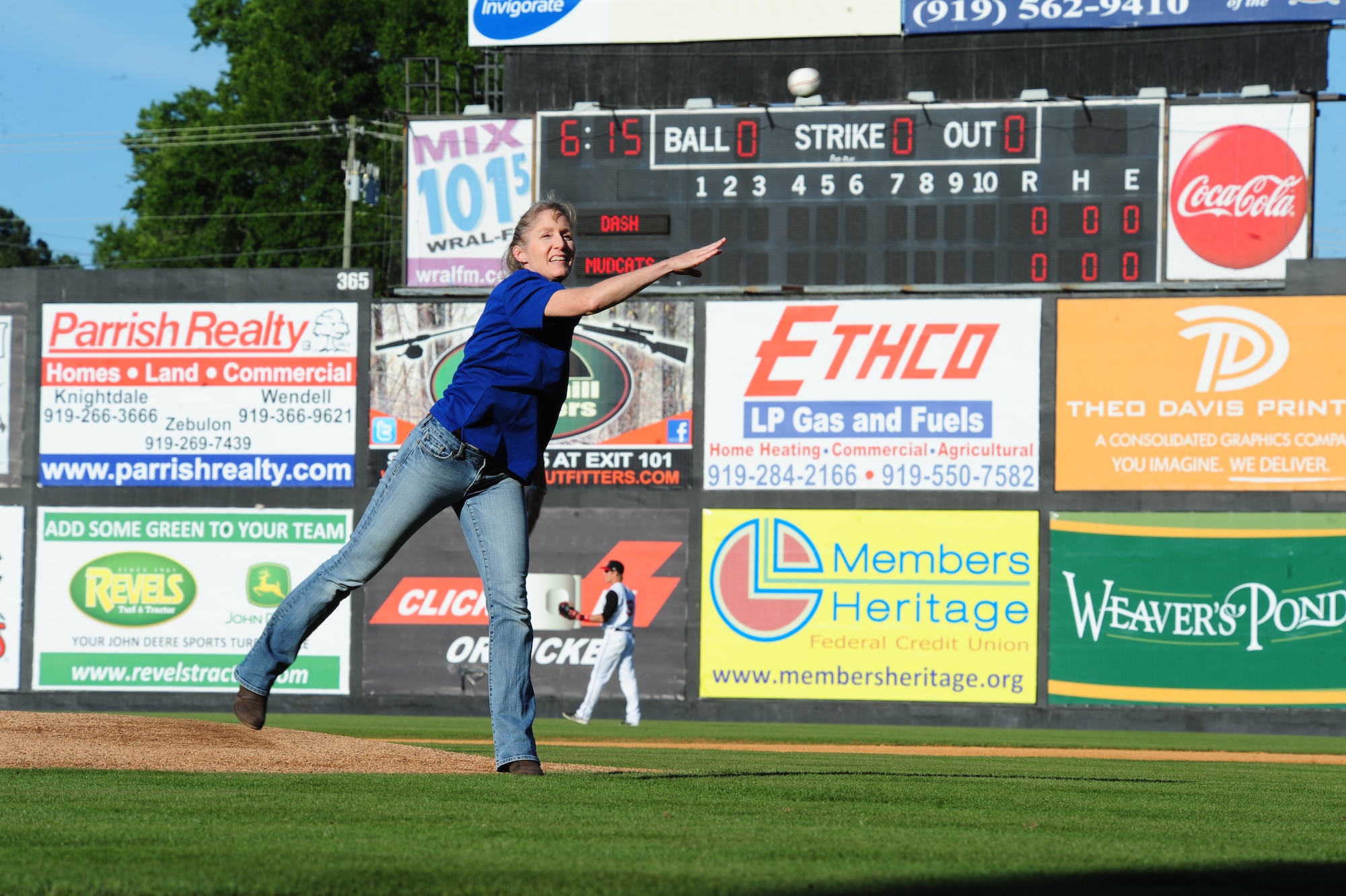 U.S. Air Force Col. Jeannie Leavitt, 4th Fighter Wing commander, delivers the opening pitch at the Carolina Mudcats stadium in Zebulon, N.C., May 25, 2013. The opening pitch is a longstanding tradition in baseball, marking the end of the pregame festivities and the start of the game. (U.S. Air Force photo by Airman 1st Class John Nieves Camacho/Released)