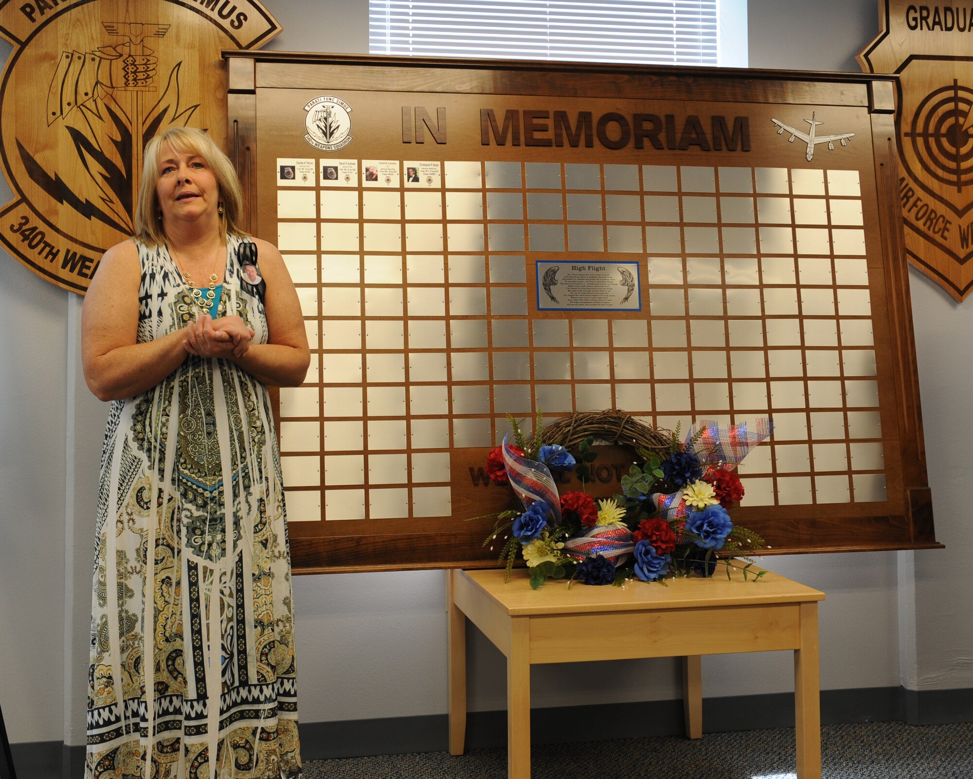The widow of Lt. Col. Emmet Drumheller gives a few words about her husband during a memorial ceremony on Barksdale Air Force Base, La., May 26, 2013. The 340th Weapons Squadron honored four deceased graduates from the B-52 instructor course. The four aviators had over 550 combined combat flying hours during their time in the Air Force. (U.S. Air Force photo/Airman 1st Class Benjamin Gonsier) 
