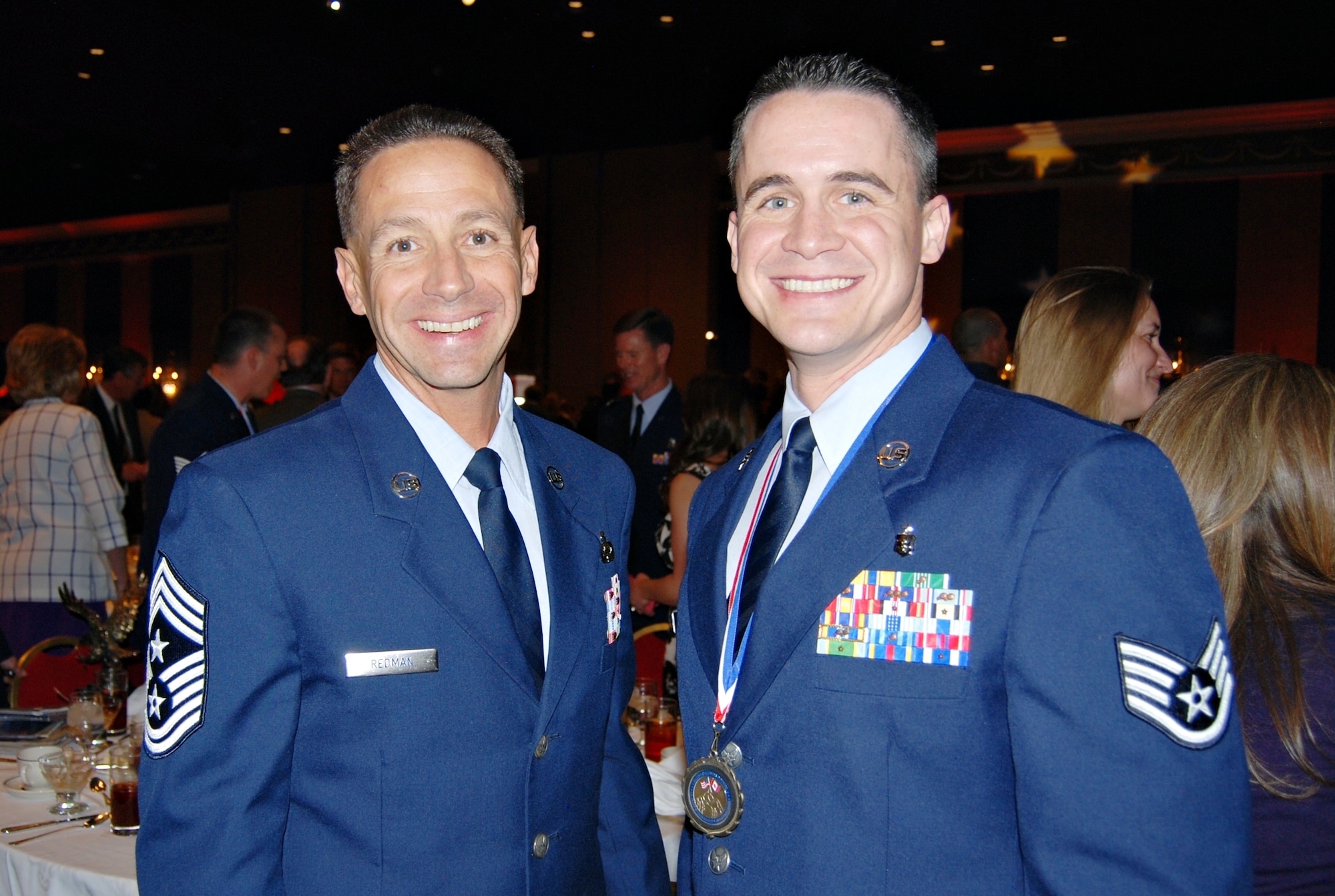 COLORADO SPRINGS, Colo. – Chief Master Sgt. Richard Redman, 21st Space Wing command chief, congratulates Staff Sgt. Donald Wheat, 21st Medical Operations Squadron, after winning the E-5 through E-6 category at the Armed Forces Week Luncheon held at the Broadmoor hotel’s International Center May 17. The annual luncheon, hosted by the Colorado Springs Regional Business Alliance, honors the men and women serving our nation. (U.S. Air Force photo/Michael Golembesky)