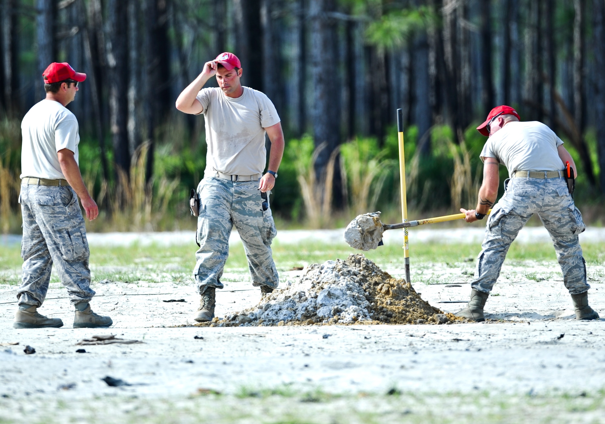 U.S. Airmen from 823rd Rapid Engineer Deployable Heavy Operational Repair Squadron Engineers, dig a hole before demolition training on Hurlburt Field, Fla., May 17, 2013. RED HORSE is known as a self-sufficient civil engineer response force capable of rapidly deploying to support contingency and special operations worldwide.  (U.S. Air Force photo/Airman 1st Class Christopher Callaway)
