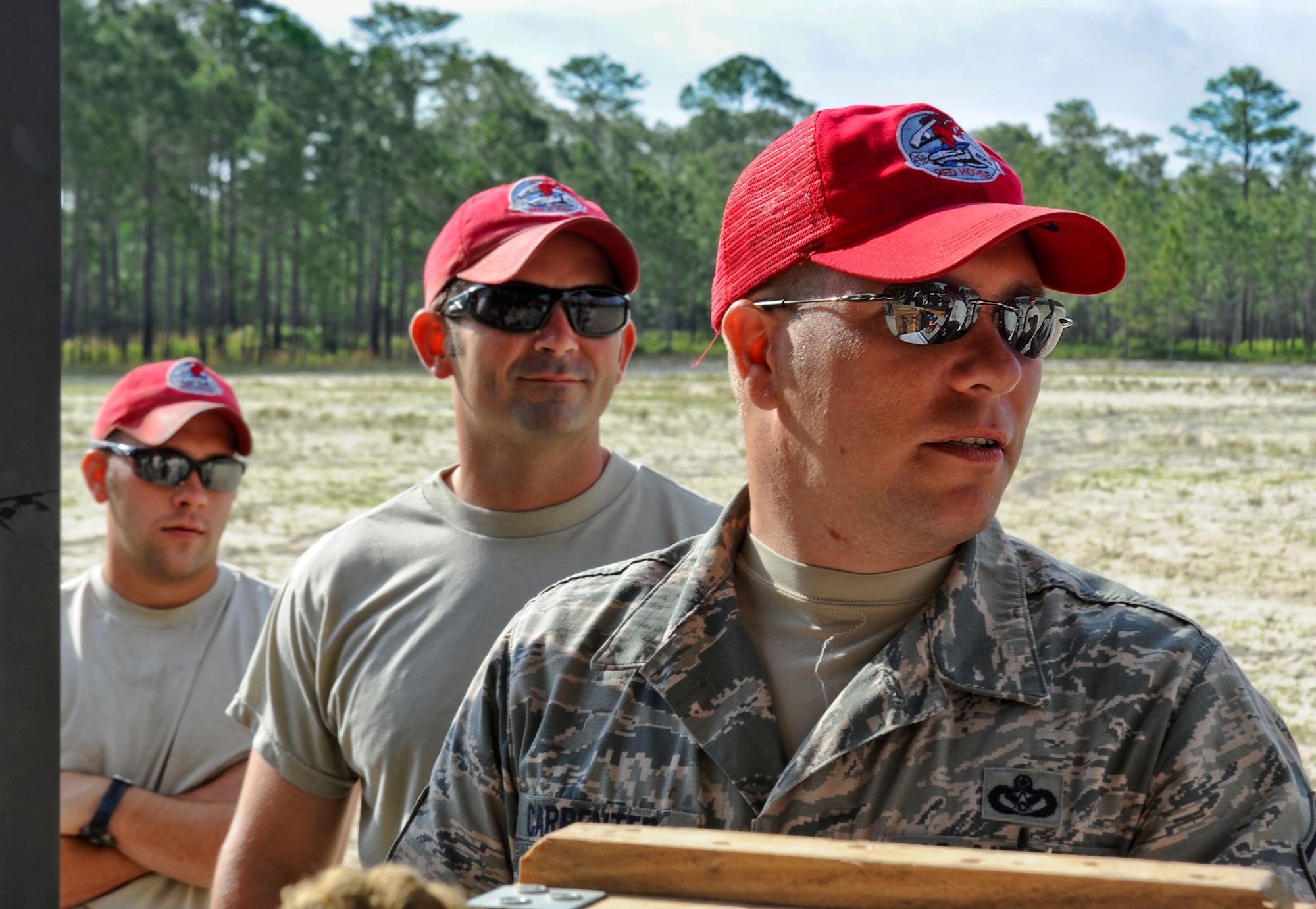 U.S. Airmen from the 823rd Rapid Engineer Deployable Heavy Operational Repair Squadron Engineers gather together for a safety brief before demolition training on Hurlburt Field, Fla., May 17, 2013. RED HORSE is known as a self-sufficient civil engineer response force capable of rapidly deploying to support contingency and special operations worldwide. (U.S. Air Force photo/Airman 1st Class Christopher Callaway) 
