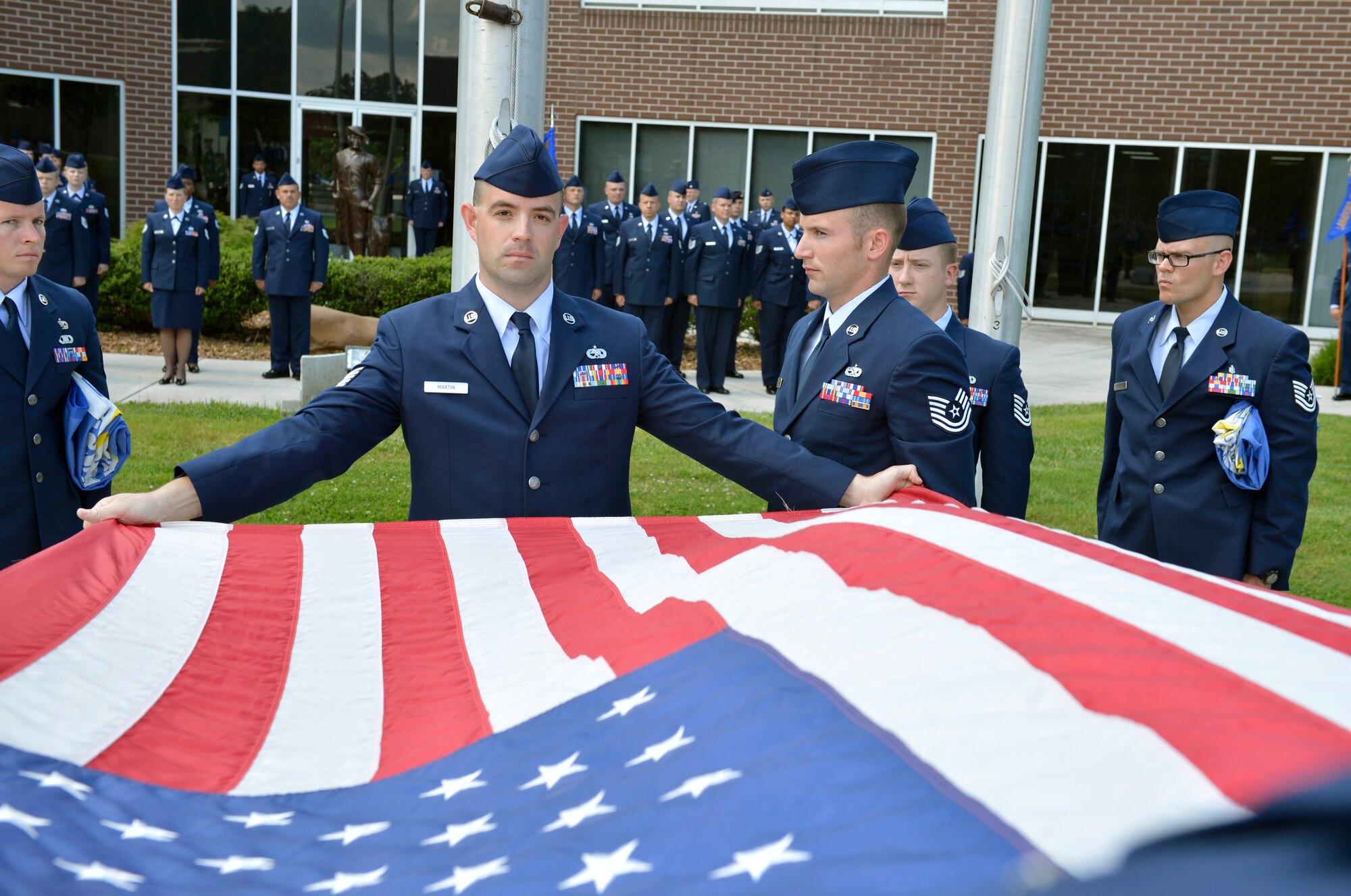 MCGHEE TYSON AIR NATIONAL GUARD BASE, Tenn. – Tech Sgt. Robert Martin from the 101st Maintenance Squadron, Bangor, Maine, participates in the graduation retreat ceremony of Noncommissioned Officer Academy here May 23, 2013 at the I.G. Brown Training and Education Center.  (U.S. Air National Guard photo by Master Sgt. Kurt Skoglund/Released)