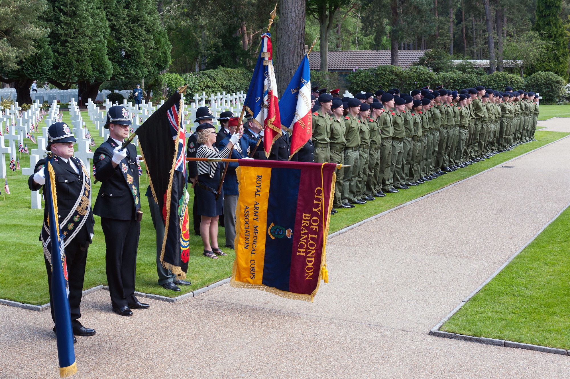 BROOKWOOD, United Kingdom – Members of the Ceremonial Association of Surrey Police and British Army 2nd Army Training Regiment, Army Training Centre, Pirbright, United Kingdom, stand in formation during the playing of the British and American national anthems during a Memorial Day Ceremony at Brookwood Military Cemetery, United Kingdom, May 26. (U.S. Air Force photo by Staff Sgt. Brian Stives)