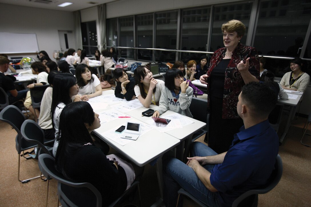 Catherine C. Latham relates personal experiences during an English club meeting at Meio University May 21 in Nago. Latham started the club in 1994 after two students came to her wishing to improve their English-speaking skills. Latham is an English professor at the university. Photo by Lance Cpl. Nicholas S. Ranum