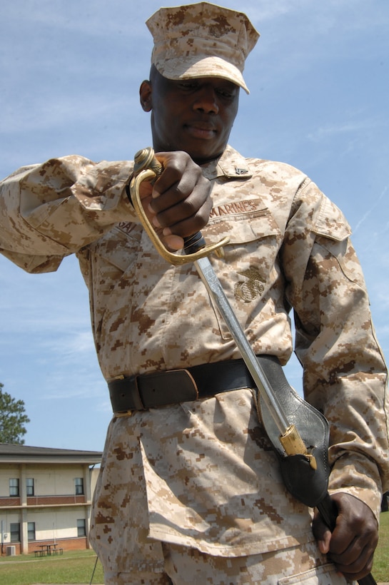 A Marine practices properly returning his sword into its scabbard during the Corporals’ Course held at Marine Corps Logistics Base Albany, May 12-24.