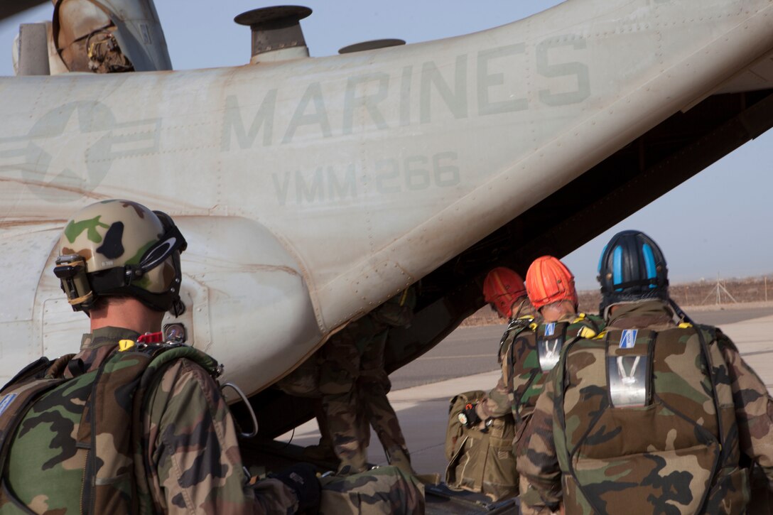26th Marine Expeditionary Unit (MEU) Maritime Raid Force Marines and elements of the French Special Forces, board an MV-22B Osprey assigned to Marine Medium Tiltrotor Squadron (VMM) 266 (Reinforced), to conduct parachute operations in Djibouti, Africa, May 25, 2013. The 26th MEU is a Marine Air-Ground Task Force forward-deployed to the U.S. 5th Fleet area of responsibility aboard the Kearsarge Amphibious Ready Group serving as a sea-based, expeditionary crisis response force capable of conducting amphibious operations across the full  range of military operations. (U.S. Marine Corps photo by Sgt. Christopher Q. Stone, 26th MEU Combat Camera/Released)