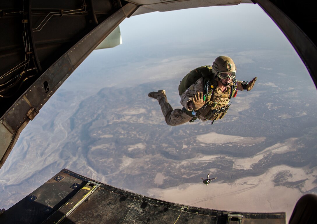 26th Marine Expeditionary Unit (MEU) Maritime Raid Force Marines exit the back of an MV-22B Osprey assigned to Marine Medium Tiltrotor Squadon (VMM) 266, (Reinforced), while conducting parachute operations with elements of the French Special Forces over Djibouti, Africa, May 25, 2013. The 26th MEU is a Marine Air-Ground Task Force forward-deployed to the U.S. 5th Fleet area of responsibility aboard the Kearsarge Amphibious Ready Group serving as a sea-based, expeditionary crisis response force capable of conducting amphibious operations across the full  range of military operations. (U.S. Marine Corps photo by Sgt. Christopher Q. Stone, 26th MEU Combat Camera/Released)