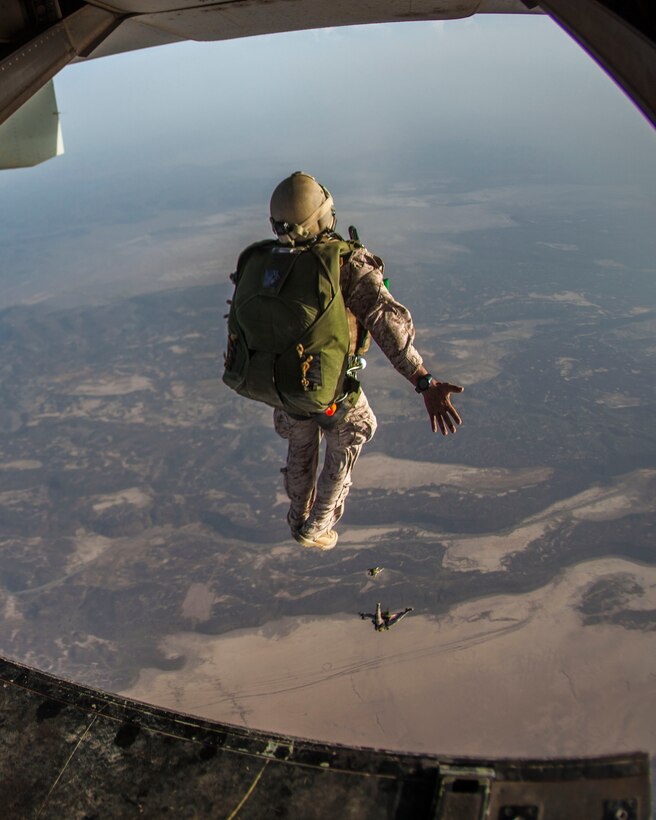 26th Marine Expeditionary Unit (MEU) Maritime Raid Force Marines exit the back of an MV-22B Osprey assigned to Marine Medium Tiltrotor Squadon (VMM) 266, (Reinforced), while conducting parachute operations with elements of the French Special Forces over Djibouti, Africa, May 25, 2013. The 26th MEU is a Marine Air-Ground Task Force forward-deployed to the U.S. 5th Fleet area of responsibility aboard the Kearsarge Amphibious Ready Group serving as a sea-based, expeditionary crisis response force capable of conducting amphibious operations across the full  range of military operations. (U.S. Marine Corps photo by Sgt. Christopher Q. Stone, 26th MEU Combat Camera/Released)