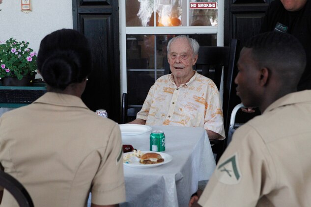 Marines with the Single Marine and Sailor program participate in a barbeque at the River Oaks assisted living community, May 23. Each year, the SMP visits the assisted living community during Valentine’s Day and Memorial Day. 