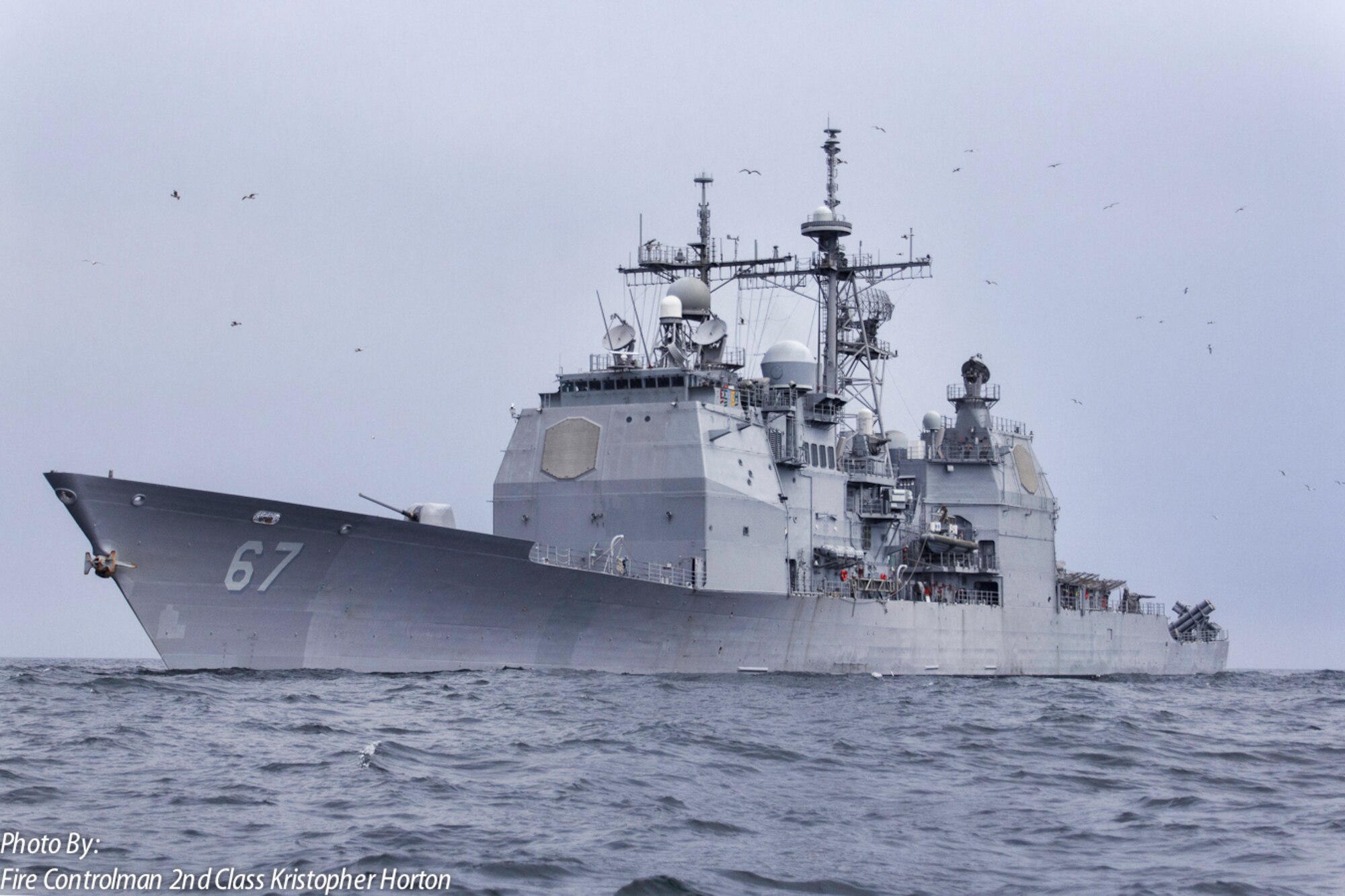 The U.S. Navy’s Ticonderoga-class guided-missile cruiser USS Shiloh travels across the Pacific Ocean on May 10, 2013. The ship's control station supported joint-training between the U.S. Navy and U.S. Air Force that controlled F-16 Fighting Falcons through various scenarios over the Pacific Ocean and mainland Japan. (U.S. Navy photo by Fire Controlman 2nd Class Kristopher Horton)