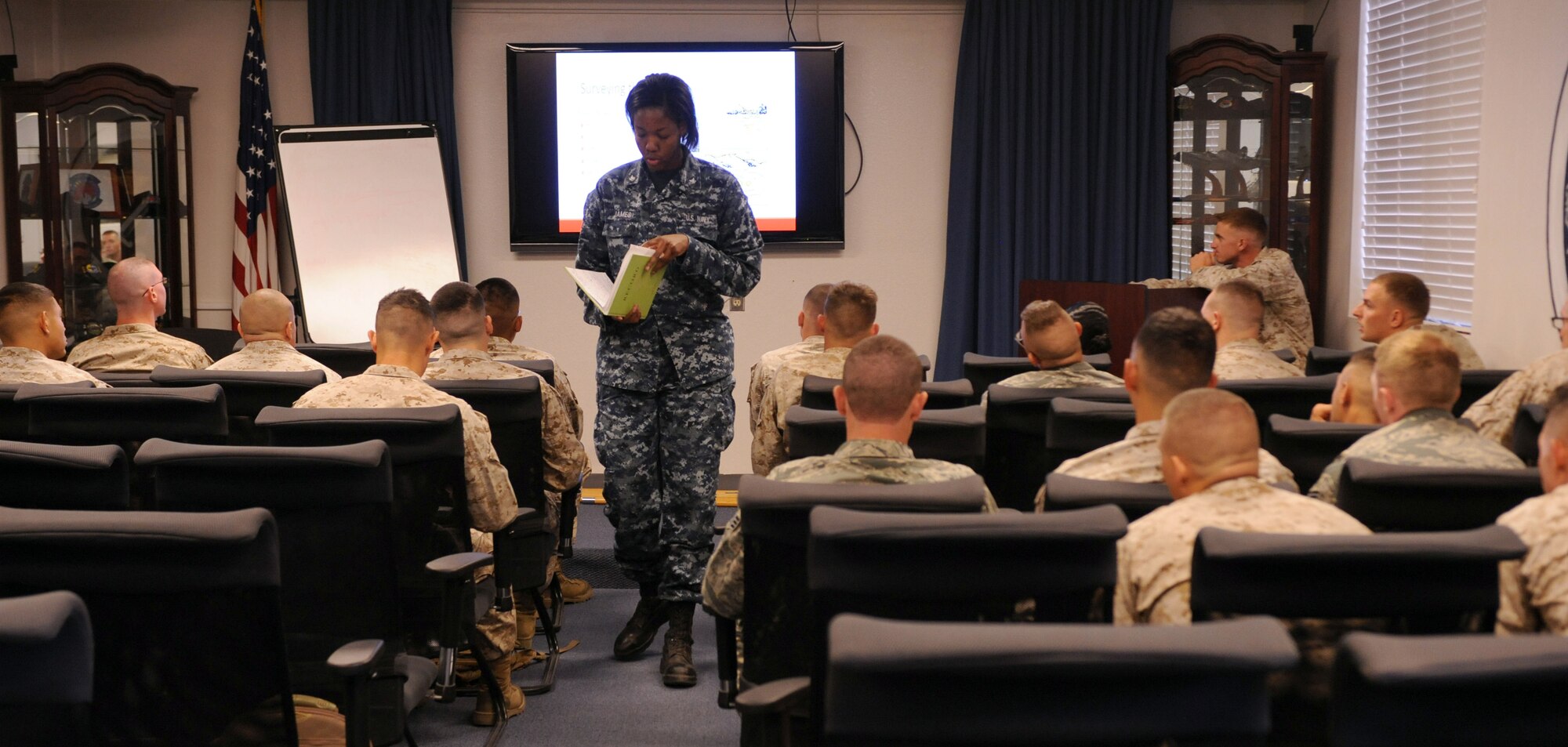 U.S. Navy Petty Officer 3rd Class Shay James, Naval Operational Support Center, gives her speech to her fellow U.S. Marine Corps Corporals Leadership Course students at Davis-Monthan Air Force Base, Ariz., May, 19, 2013. The course taught students a medley of skills to better prepare them as leaders in their respective services. (U.S. Air Force photo by Senior Airman Timothy Moore/Released)