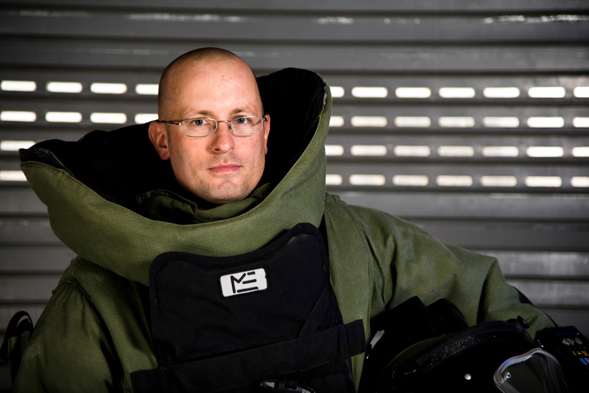JOINT BASE ELMENDORF-RICHARDSON, Alaska -- Tech. Sgt. Dustin Lambries, an Explosive Ordinance Disposal craftsman, poses for a photo for his submission to Air Force Portraits in Courage at the EOD compound, May 24, 2013. The Portraits in Courage series highlights Airmen who display bravery and determination in the face of especially challenging or dangerous circumstances. 