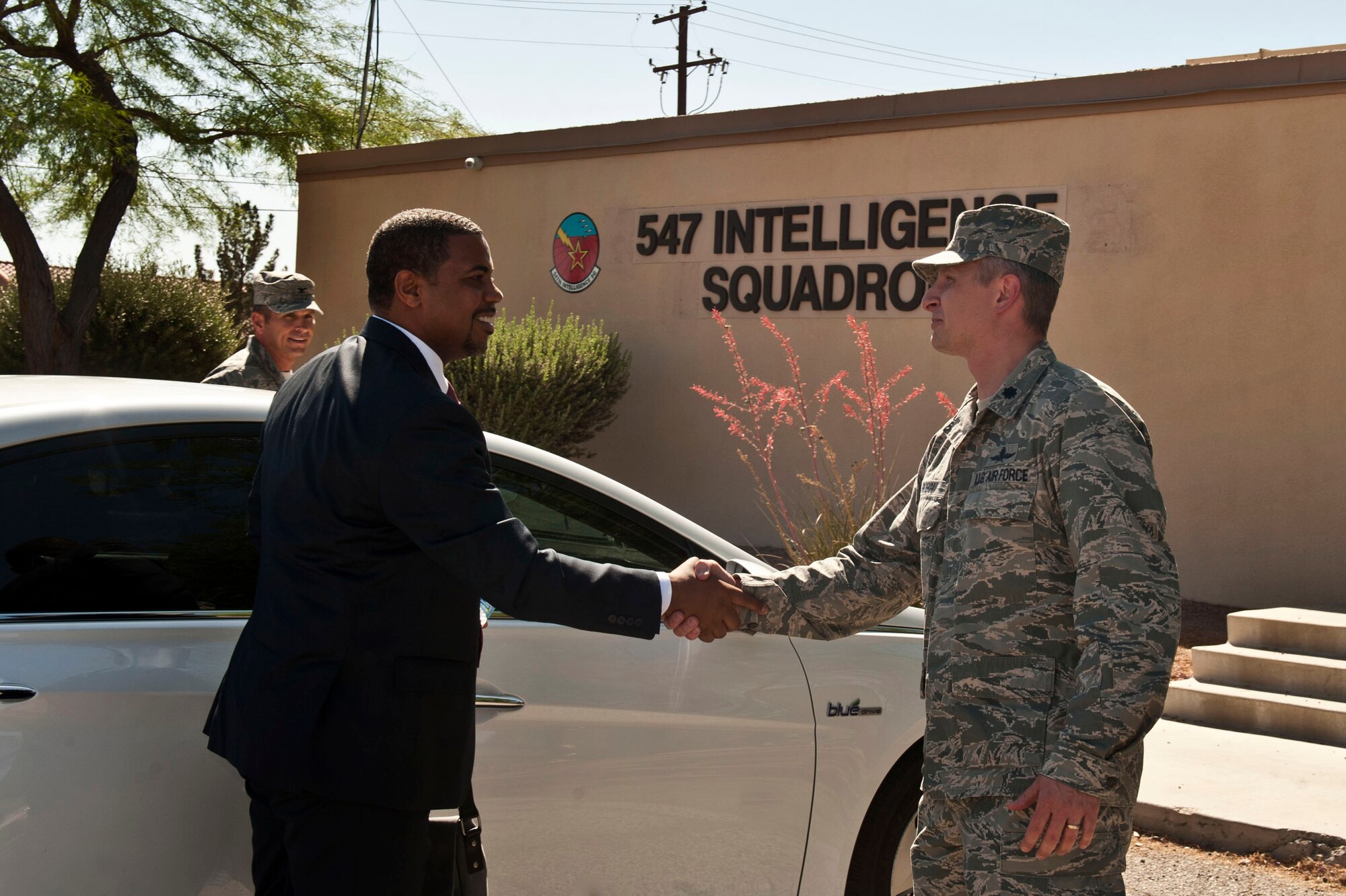 Congressman Steven Horsford is greeted by U.S. Air Force Lt. Col. John Robin, 57th Information Aggressor Squadron commander, as he arrives for a briefing about information assurance at the 547th Intelligence Squadron May 29, 2013, at Nellis Air Force Base, Nev. Horsford is currently on the Homeland Security Committee for Cyber Security, Infrastructure Protection and Security technologies. (U.S. Air Force photo by Senior Airman Daniel Hughes)
 
