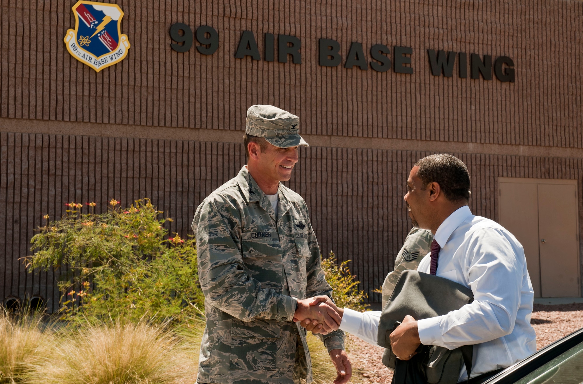 U.S. Air Force Col. Barry Cornish, 99th Air Base Wing commander, greets Congressman Steven Horsford, during a visit to Nellis Air Force Base, Nev. May 29, 2013. Horsford represents Nevada’s newly created Fourth Congressional District. (U.S. Air Force photo by Senior Airman Daniel Hughes)