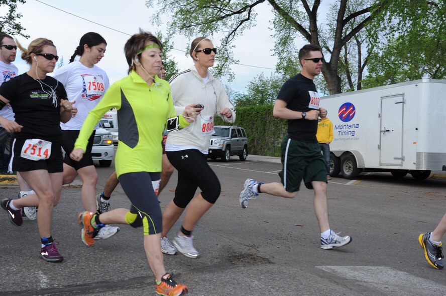 Members of Team Malmstrom and Great Falls keep a steady pace during Scheels’ Red White and Blue 5K in Great Falls on May 25. More than 100 participated in the first-of-its-kind event. (U.S. Air Force photo/Airman 1st Class Katrina Heikkinen)