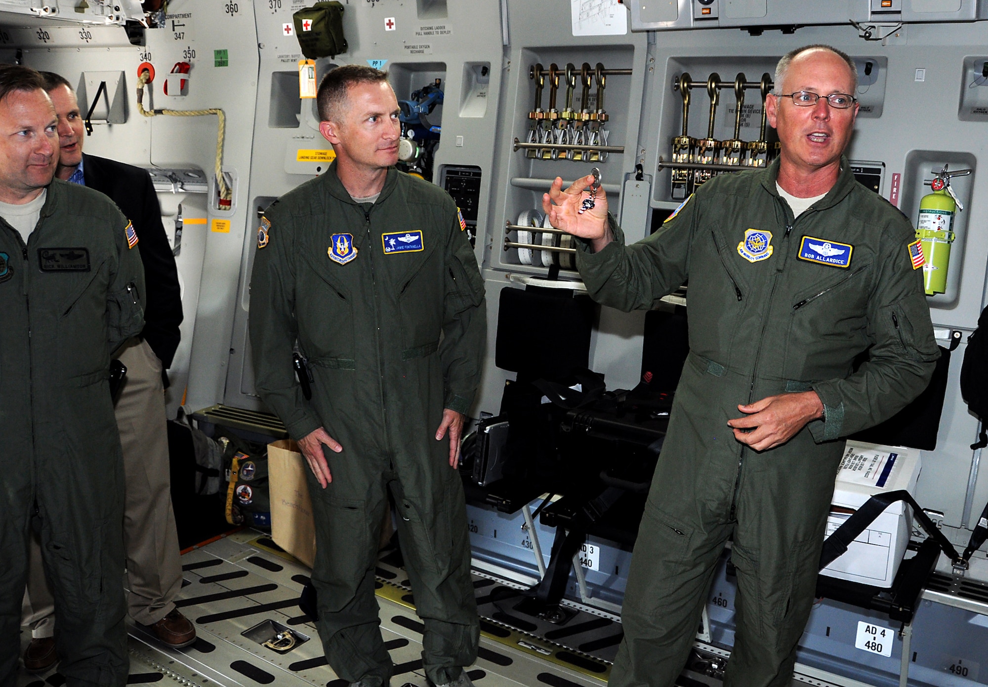 Lt. Gen. Robert R. Allardice, Air Mobility Command vice commander, holds up a ceremonial key for an audience of military members and local community leaders. "I have the ceremonial key," The General said. "Jamie, it's an honor for me to present to you the second to last - the 222nd - C-17 of the program." Col. James Fontanella, 315th Airlift Wing commander, accepted the ceremonial key for 22nd C-17 Globemaster III in the Air Air Force inventory and the second to last in the Air Force C-17 program to leave the Boeing plant in Long Beach, Calif. after the jet landed at Joint Base Charleston, S.C. May 30. (U.S. Air Force Reserve Photo by Michael Dukes)