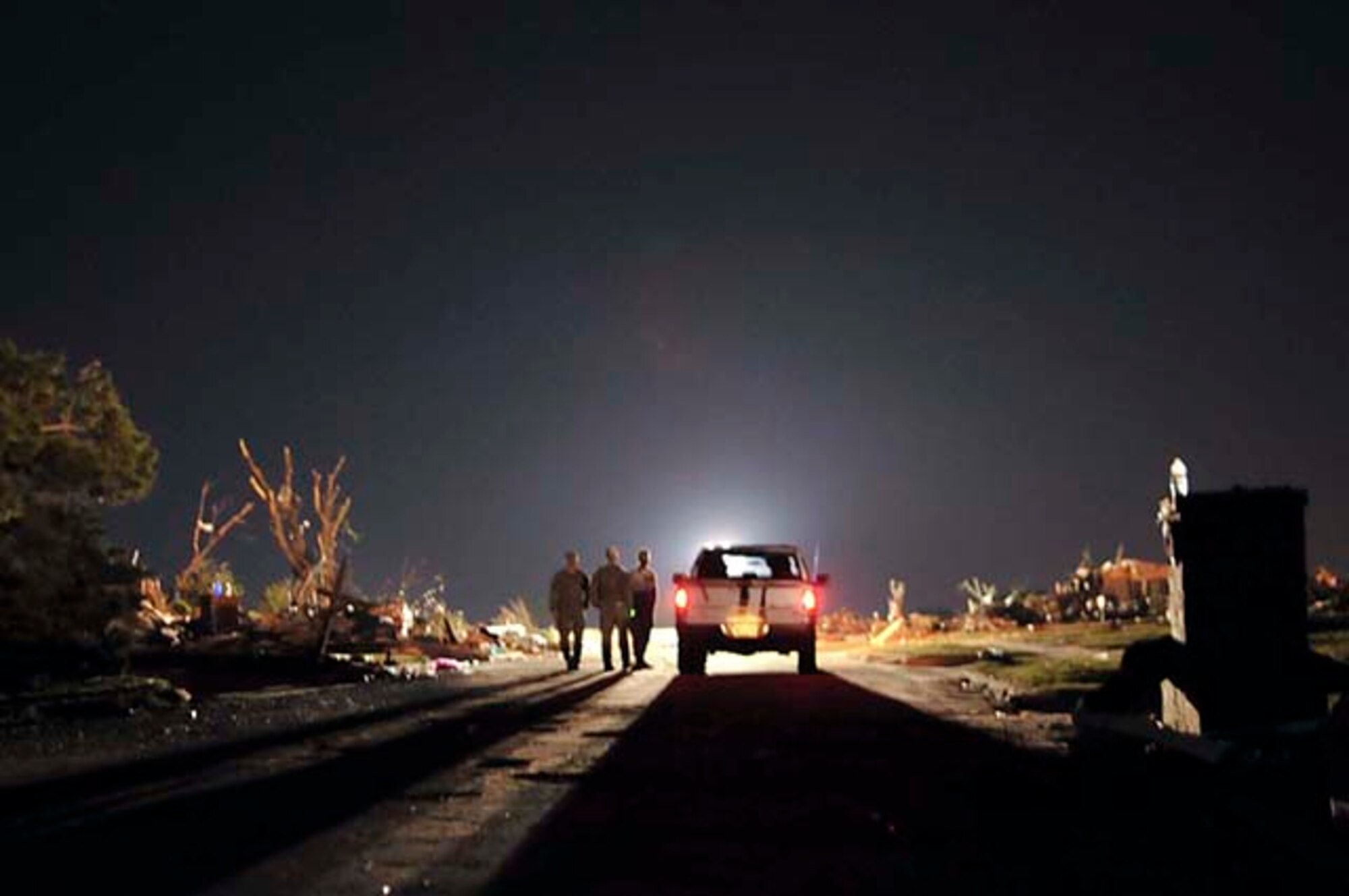 Airmen assigned to the 146th Air Support Squadron, Will Rogers Air National Guard Base provide security through a neighborhood that was completely destroyed by the May 20 tornado in Moore, Okla., May 22, 2013. Military rescue, relief and security efforts have been deployed by Oklahoma's governor, Mary Fallin. (U.S. Air Force photo/Staff Sgt. Caroline Hayworth)