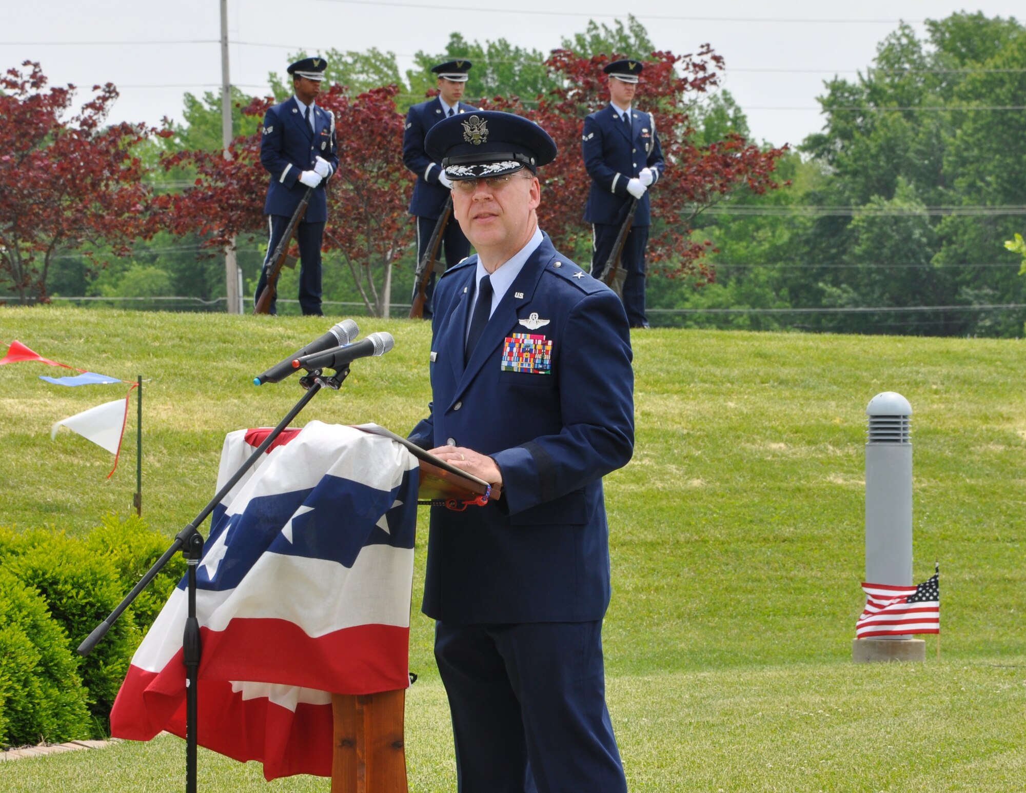 Brig. Gen. Lawrence Martin, 618th Air and Space Operations Center (Tanker Airlift Control Center) vice commander, speaks about honoring those who paid the ultimate sacrifice and their families Memorial Day at the O'Fallon Veteran's Monument, O'Fallon, Ill. Twenty-three new names were inscribed to the memorial. Approximately 300 area residents attended the event. (U.S. Air Force photo/Maj. Angela O'Connell)

