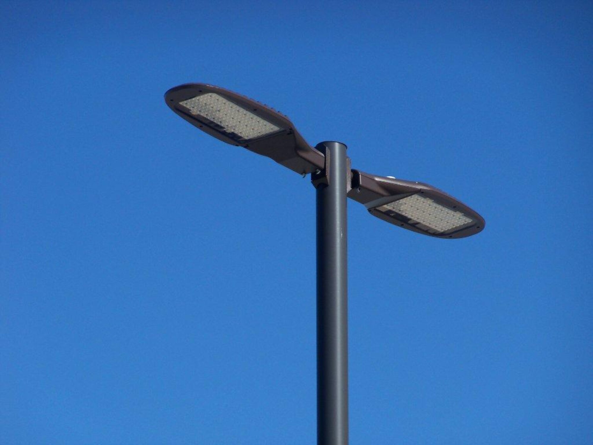 Air Force Space Command is the first in the Air Force to centrally procure
light emitting diode fixtures like this one. The $4.9 million contract
includes 6,600 LED street lights to be installed across the command.
Compared to older technology, the new lights will use half the energy and
reduce operations and maintenance costs by $975,000 annually. This is one of
several energy initiatives that earned AFSPC the Society of American
Military Engineers 2012 Sustainability Award for education and outreach.
Awards were distributed May 2013. (U.S. Air Force photo)

