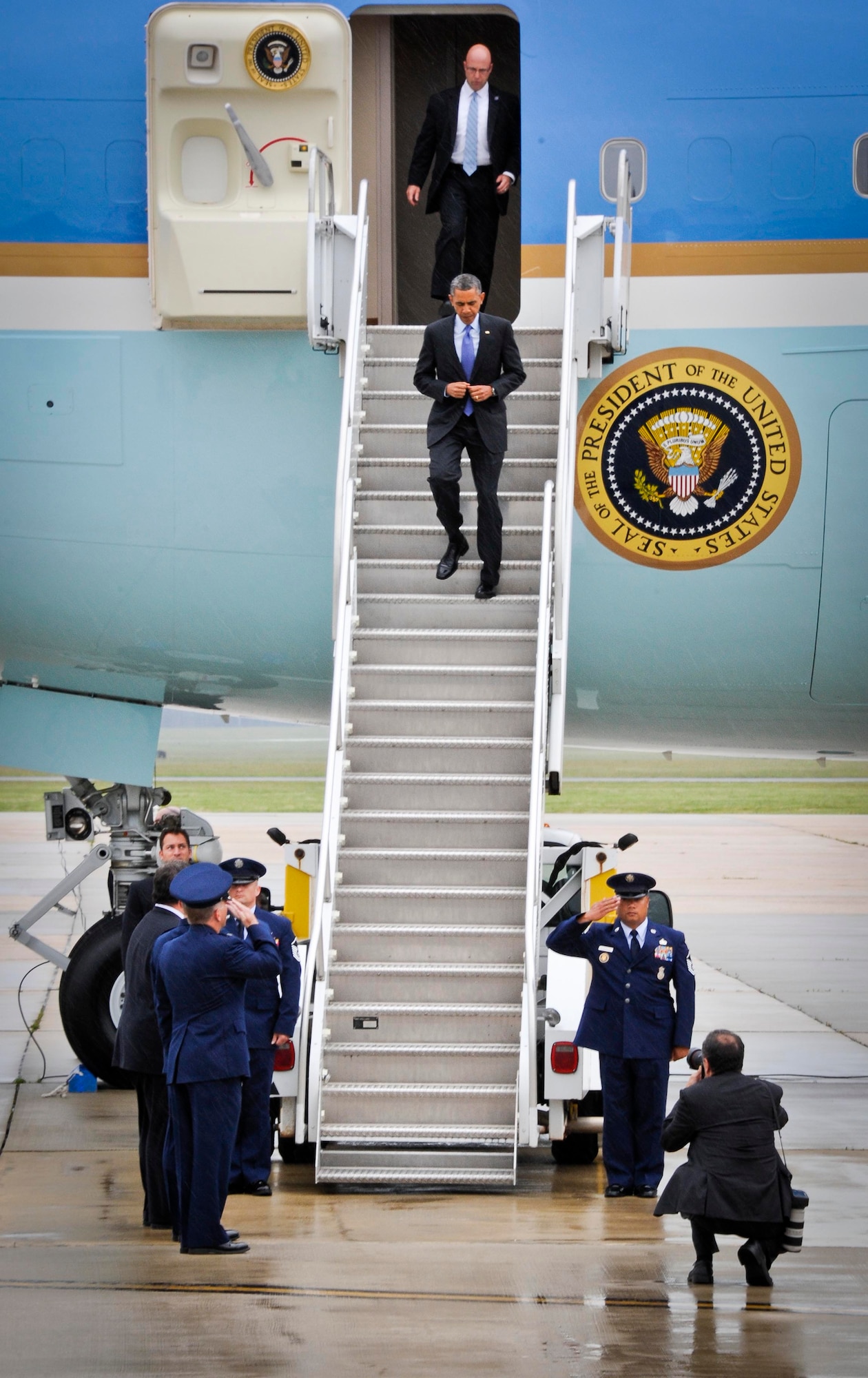 President Barack Obama disembarks Air Force One at McGuire Field May 28, 2013, at Joint Base McGuire-Dix-Lakehurst, N.J. He greeted New Jersey Gov. Chris Christie and Cols. John Wood and Rick Williamson, 87th Air Base Wing and 305th Air Mobility Wing commanders, respectively. (U.S. Air Force photo by Airman 1st Class Ryan Throneberry/Released)