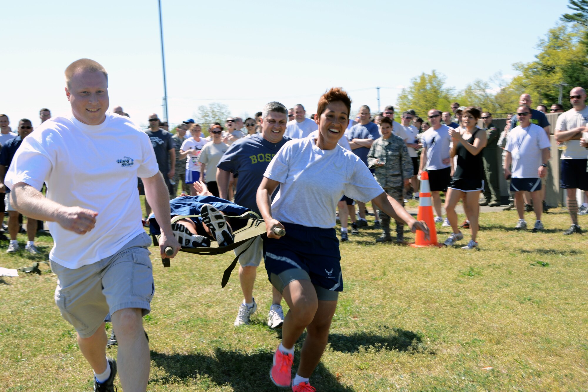 Members of the 103rd Airlift Wing perform a litter-carry exercise during the first ever 103rd Airlift Wing Warrior Day, May 4, 2013, at Bradley Air National Guard Base in East Granby, Conn. The warrior day was full of competitions that aimed to increase the esprit de corps of the Flying Yankees while promoting physical fitness and unit cohesion. (U.S. Air National Guard photo by Senior Airman Emmanuel Santiago/Released)