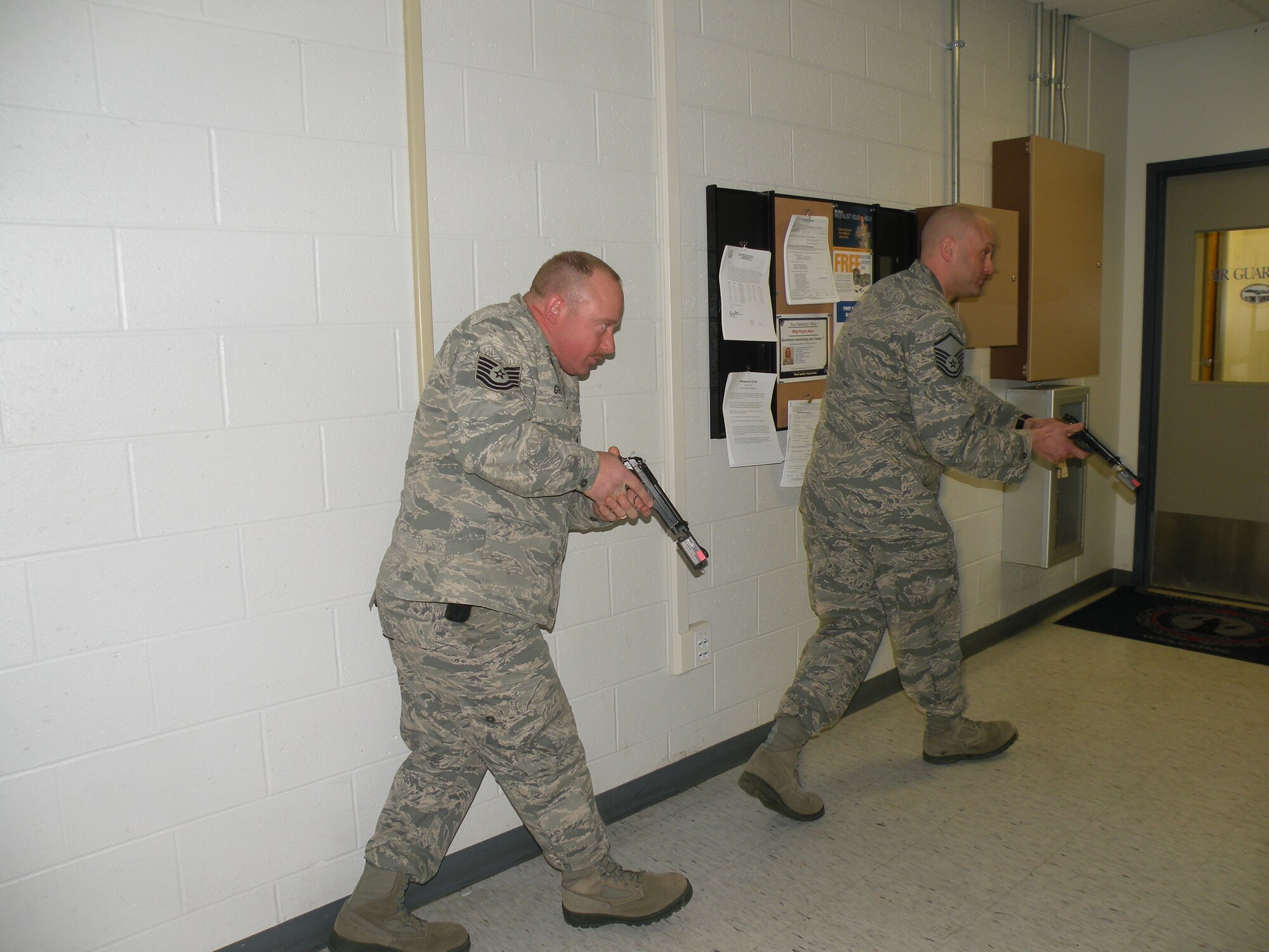 Tech. Sgt. Stephen Grippen and Master Sgt. Chris Redo of the 103rd Security Forces Squadron prepare to clear a room as part of a training exercise at Bradley Air National Guard Base, East Granby, Conn. in 2013. (Photos courtesy of Tech. Sgt. Jessica Roy)